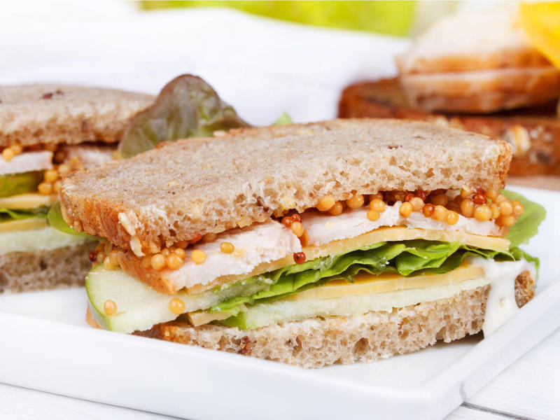 WEST VIRGINIA: An apple and turkey sandwich ALABAMA: A chicken sandwich with white barbecue sauce, ALASKA: A wild Alaskan salmon sandwich, ARIZONA: Frybread tacos, ARKANSAS: A deep-fried catfish sandwich, CALIFORNIA: An avocado club sandwich, COLORADO: A Denver sandwich, CONNECTICUT: A Connecticut hamburger, DELAWARE: A soft-shell fried crab sandwich, FLORIDA: A Cuban sandwich, GEORGIA: A fried chicken sandwich, HAWAII: A Kālua-style pork sandwich, ILLINOIS: A Horseshoe sandwich, INDIANA: A Hoosier sandwich, IOWA: A Tavern or "loose meat" sandwich, KANSAS: "Runza" or "bierocks", KENTUCKY: A Hot Brown sandwich, LOUISIANA: A po'boy, MARYLAND: A crab-cake sandwich, MASSACHUSETTS: A Fluffernutter, MICHIGAN: A corned beef sandwich, MINNESOTA: A Jucy Lucy, MISSISSIPPI: A pig-ear sandwich, MISSOURI: A Gerber sandwich, MONTANA: A PB&J with huckleberry jam, NEBRASKA: A Reuben, NEVADA: A Heart Attack Grill burger, NEW HAMPSHIRE: A fried ham and cheese Monte Cristo drizzled with syrup, NEW JERSEY: A Jersey breakfast sandwich, NEW MEXICO: A green chile cheeseburger, NORTH CAROLINA: A pulled-pork sandwich, NORTH DAKOTA: Smørbrød, OHIO: A Polish boy, OKLAHOMA: A chicken-fried steak sandwich, OREGON: A falafel pita, PENNSYLVANIA: A Philly cheesesteak, RHODE ISLAND: A Dynamite sandwich, SOUTH CAROLINA: A tuna melt, SOUTH DAKOTA: A walleye sandwich, TENNESSEE: A Fluffernutter, TEXAS: A brisket sandwich, UTAH: A pastrami burger, VERMONT: A Vermonter, VIRGINIA: A grilled ham and cheese, WASHINGTON: Bánh mì, WEST VIRGINIA: An apple and turkey sandwich, WISCONSIN: A sausage roll or brat bun, WYOMING: A bison meatball sandwich