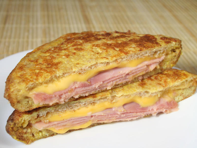 NEW HAMPSHIRE: A fried ham and cheese Monte Cristo drizzled with syrup ALABAMA: A chicken sandwich with white barbecue sauce, ALASKA: A wild Alaskan salmon sandwich, ARIZONA: Frybread tacos, ARKANSAS: A deep-fried catfish sandwich, CALIFORNIA: An avocado club sandwich, COLORADO: A Denver sandwich, CONNECTICUT: A Connecticut hamburger, DELAWARE: A soft-shell fried crab sandwich, FLORIDA: A Cuban sandwich, GEORGIA: A fried chicken sandwich, HAWAII: A Kālua-style pork sandwich, ILLINOIS: A Horseshoe sandwich, INDIANA: A Hoosier sandwich, IOWA: A Tavern or "loose meat" sandwich, KANSAS: "Runza" or "bierocks", KENTUCKY: A Hot Brown sandwich, LOUISIANA: A po'boy, MARYLAND: A crab-cake sandwich, MASSACHUSETTS: A Fluffernutter, MICHIGAN: A corned beef sandwich, MINNESOTA: A Jucy Lucy, MISSISSIPPI: A pig-ear sandwich, MISSOURI: A Gerber sandwich, MONTANA: A PB&J with huckleberry jam, NEBRASKA: A Reuben, NEVADA: A Heart Attack Grill burger, NEW HAMPSHIRE: A fried ham and cheese Monte Cristo drizzled with syrup, NEW JERSEY: A Jersey breakfast sandwich, NEW MEXICO: A green chile cheeseburger, NORTH CAROLINA: A pulled-pork sandwich, NORTH DAKOTA: Smørbrød, OHIO: A Polish boy, OKLAHOMA: A chicken-fried steak sandwich, OREGON: A falafel pita, PENNSYLVANIA: A Philly cheesesteak, RHODE ISLAND: A Dynamite sandwich, SOUTH CAROLINA: A tuna melt, SOUTH DAKOTA: A walleye sandwich, TENNESSEE: A Fluffernutter, TEXAS: A brisket sandwich, UTAH: A pastrami burger, VERMONT: A Vermonter, VIRGINIA: A grilled ham and cheese, WASHINGTON: Bánh mì, WEST VIRGINIA: An apple and turkey sandwich, WISCONSIN: A sausage roll or brat bun, WYOMING: A bison meatball sandwich