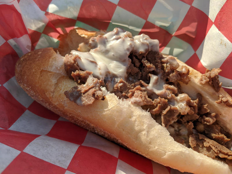 PENNSYLVANIA: A Philly cheesesteak ALABAMA: A chicken sandwich with white barbecue sauce, ALASKA: A wild Alaskan salmon sandwich, ARIZONA: Frybread tacos, ARKANSAS: A deep-fried catfish sandwich, CALIFORNIA: An avocado club sandwich, COLORADO: A Denver sandwich, CONNECTICUT: A Connecticut hamburger, DELAWARE: A soft-shell fried crab sandwich, FLORIDA: A Cuban sandwich, GEORGIA: A fried chicken sandwich, HAWAII: A Kālua-style pork sandwich, ILLINOIS: A Horseshoe sandwich, INDIANA: A Hoosier sandwich, IOWA: A Tavern or "loose meat" sandwich, KANSAS: "Runza" or "bierocks", KENTUCKY: A Hot Brown sandwich, LOUISIANA: A po'boy, MARYLAND: A crab-cake sandwich, MASSACHUSETTS: A Fluffernutter, MICHIGAN: A corned beef sandwich, MINNESOTA: A Jucy Lucy, MISSISSIPPI: A pig-ear sandwich, MISSOURI: A Gerber sandwich, MONTANA: A PB&J with huckleberry jam, NEBRASKA: A Reuben, NEVADA: A Heart Attack Grill burger, NEW HAMPSHIRE: A fried ham and cheese Monte Cristo drizzled with syrup, NEW JERSEY: A Jersey breakfast sandwich, NEW MEXICO: A green chile cheeseburger, NORTH CAROLINA: A pulled-pork sandwich, NORTH DAKOTA: Smørbrød, OHIO: A Polish boy, OKLAHOMA: A chicken-fried steak sandwich, OREGON: A falafel pita, PENNSYLVANIA: A Philly cheesesteak, RHODE ISLAND: A Dynamite sandwich, SOUTH CAROLINA: A tuna melt, SOUTH DAKOTA: A walleye sandwich, TENNESSEE: A Fluffernutter, TEXAS: A brisket sandwich, UTAH: A pastrami burger, VERMONT: A Vermonter, VIRGINIA: A grilled ham and cheese, WASHINGTON: Bánh mì, WEST VIRGINIA: An apple and turkey sandwich, WISCONSIN: A sausage roll or brat bun, WYOMING: A bison meatball sandwich