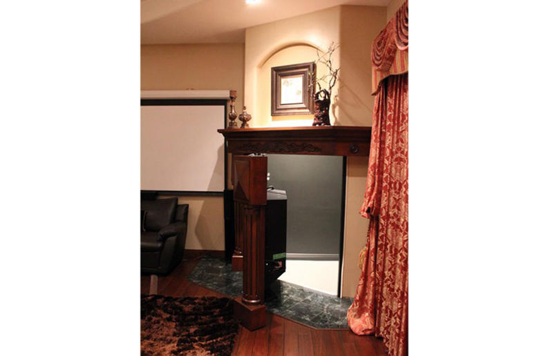 The fireplace safe room Blink and you'll miss these hidden rooms, Secret sliding fireplace, Hidden mirror door, Curious cabinets, A transforming wall, Concrete doorway, Billiard room hideaway, The hidden wardrobe hangout, A hidden media room, No ordinary staircase, The hidden mini passageway, The clandestine lounge, The fireplace safe room, A secret sleeping space
