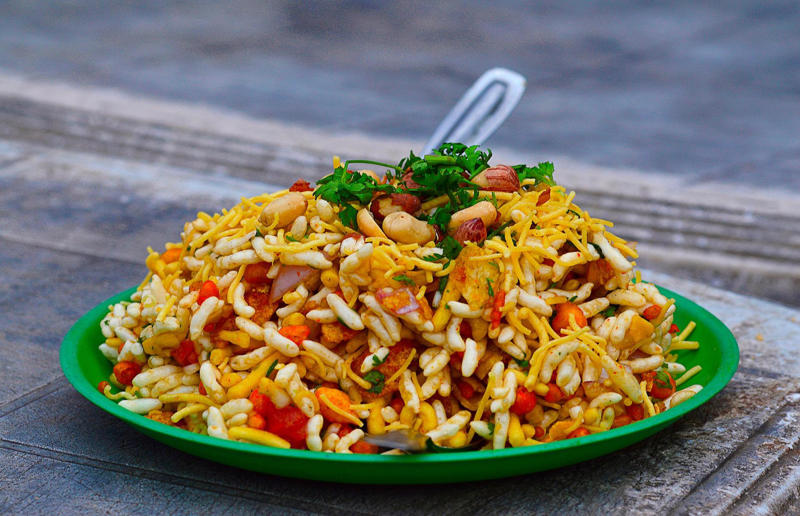 25. Bhelpuri, India 36. Bitterballen, Netherlands, 35. Pierogi, Poland, 34. Choripán, Argentina, 33. Slider, USA, 32. Elote, Mexico, 31. Rolex, Uganda, 30. Pad Thai, Thailand, 29. Souvlaki, Greece, 28. Bhelpuri, India, 27. Bánh mì, Vietnam, 26. Ta’ameya, Egypt, 25. Chǎofàn, China, 24. Shawarma, Turkey, 23. Arepa, Venezuela and Colombia, 22. Vada pav, India, 21. Gyros, Greece, 20. Churros, Spain, 19. Bao buns, China, 18. Fish and chips, UK, 17. Takoyaki, Japan, 16. Currywurst, Germany, 15. Burrito, Mexico or USA, 14. Döner kebab, Germany, 13. Bunny chow, South Africa, 12. Tacos, Mexico, 11. Meat pie, Australia, 10. Bratwurst, Germany, 9. Samosa, India, 8. Poutine, Canada, 7. Cheeseburger, USA, 6. Fried chicken, various locations, 5. Hot dog, various locations, 4. Fried chicken sandwich, USA, 3. Pizza, Italy, 2. Hamburger, various locations
