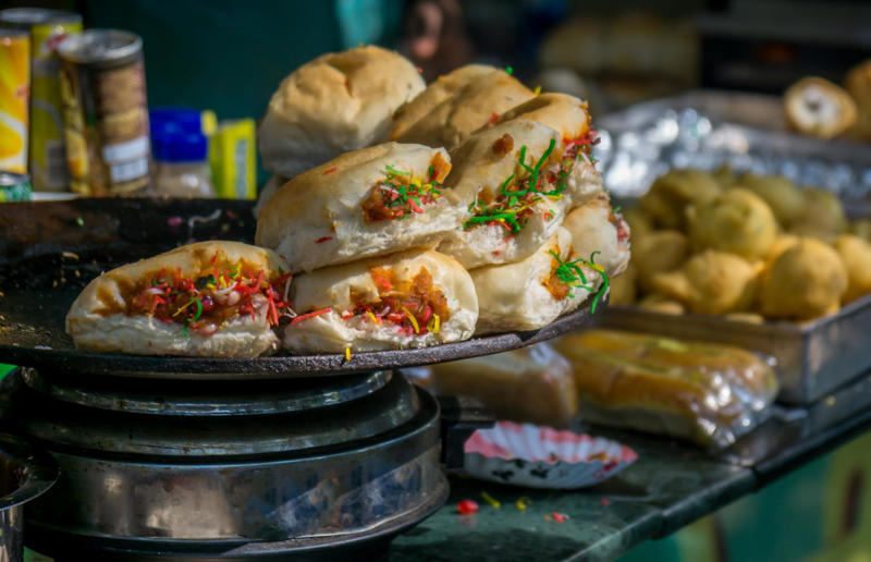 21. Vada pav, India 36. Bitterballen, Netherlands, 35. Pierogi, Poland, 34. Choripán, Argentina, 33. Slider, USA, 32. Elote, Mexico, 31. Rolex, Uganda, 30. Pad Thai, Thailand, 29. Souvlaki, Greece, 28. Bhelpuri, India, 27. Bánh mì, Vietnam, 26. Ta’ameya, Egypt, 25. Chǎofàn, China, 24. Shawarma, Turkey, 23. Arepa, Venezuela and Colombia, 22. Vada pav, India, 21. Gyros, Greece, 20. Churros, Spain, 19. Bao buns, China, 18. Fish and chips, UK, 17. Takoyaki, Japan, 16. Currywurst, Germany, 15. Burrito, Mexico or USA, 14. Döner kebab, Germany, 13. Bunny chow, South Africa, 12. Tacos, Mexico, 11. Meat pie, Australia, 10. Bratwurst, Germany, 9. Samosa, India, 8. Poutine, Canada, 7. Cheeseburger, USA, 6. Fried chicken, various locations, 5. Hot dog, various locations, 4. Fried chicken sandwich, USA, 3. Pizza, Italy, 2. Hamburger, various locations