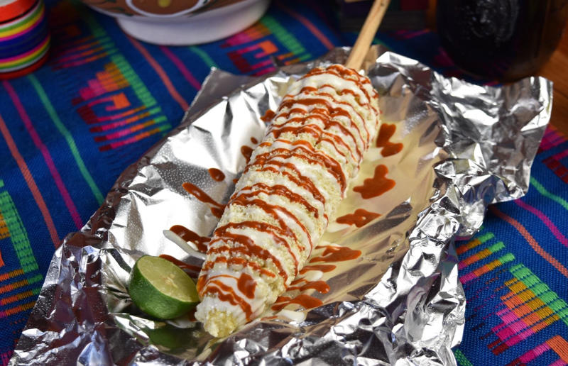 28. Elote, Mexico 36. Bitterballen, Netherlands, 35. Pierogi, Poland, 34. Choripán, Argentina, 33. Slider, USA, 32. Elote, Mexico, 31. Rolex, Uganda, 30. Pad Thai, Thailand, 29. Souvlaki, Greece, 28. Bhelpuri, India, 27. Bánh mì, Vietnam, 26. Ta’ameya, Egypt, 25. Chǎofàn, China, 24. Shawarma, Turkey, 23. Arepa, Venezuela and Colombia, 22. Vada pav, India, 21. Gyros, Greece, 20. Churros, Spain, 19. Bao buns, China, 18. Fish and chips, UK, 17. Takoyaki, Japan, 16. Currywurst, Germany, 15. Burrito, Mexico or USA, 14. Döner kebab, Germany, 13. Bunny chow, South Africa, 12. Tacos, Mexico, 11. Meat pie, Australia, 10. Bratwurst, Germany, 9. Samosa, India, 8. Poutine, Canada, 7. Cheeseburger, USA, 6. Fried chicken, various locations, 5. Hot dog, various locations, 4. Fried chicken sandwich, USA, 3. Pizza, Italy, 2. Hamburger, various locations