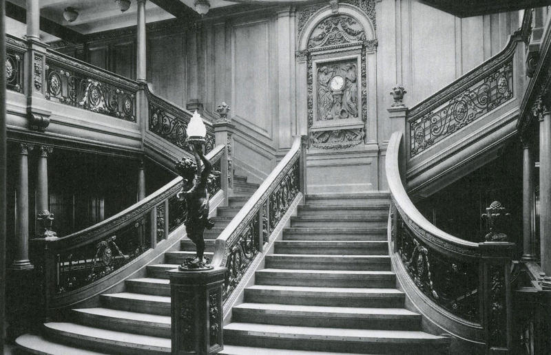 The grand staircase Take a tour around the beautiful ill-fated ship, A world first, Who commissioned the Titanic?, Harland & Wolff, the Titanic shipbuilders, Who designed the Titanic?, A cross-section of the Titanic, A veritable city, Propulsion system, Titanic costs, Ready to launch, The crew of the Titanic, The passengers, A floating hotel, The grand staircase, Gilded details, Luxurious public rooms, Regal dining room, The Café Parisien, Three classes of accommodation, Luxury first-class suites, Ornate living spaces, Top-notch amenities, State-of-the-art swimming pool, Comfortable second-class cabins, Modest third-class cabins, Top-of-the-line technology, Safety features and failings, The fateful collision, 20 lifeboats, "We are going down”, What sank the Titanic?, A preventable tragedy, A lasting legacy
