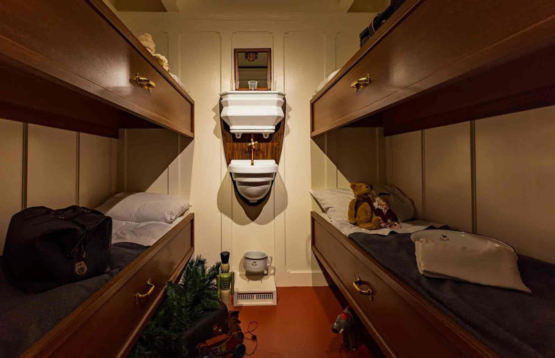 Modest third-class cabins Take a tour around the beautiful ill-fated ship, A world first, Who commissioned the Titanic?, Harland & Wolff, the Titanic shipbuilders, Who designed the Titanic?, A cross-section of the Titanic, A veritable city, Propulsion system, Titanic costs, Ready to launch, The crew of the Titanic, The passengers, A floating hotel, The grand staircase, Gilded details, Luxurious public rooms, Regal dining room, The Café Parisien, Three classes of accommodation, Luxury first-class suites, Ornate living spaces, Top-notch amenities, State-of-the-art swimming pool, Comfortable second-class cabins, Modest third-class cabins, Top-of-the-line technology, Safety features and failings, The fateful collision, 20 lifeboats, "We are going down”, What sank the Titanic?, A preventable tragedy, A lasting legacy