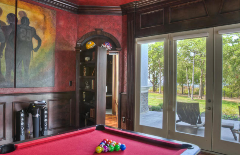 Billiard room hideaway Blink and you'll miss these hidden rooms, Secret sliding fireplace, Hidden mirror door, Curious cabinets, A transforming wall, Concrete doorway, Billiard room hideaway, The hidden wardrobe hangout, A hidden media room, No ordinary staircase, The hidden mini passageway, The clandestine lounge, The fireplace safe room, A secret sleeping space