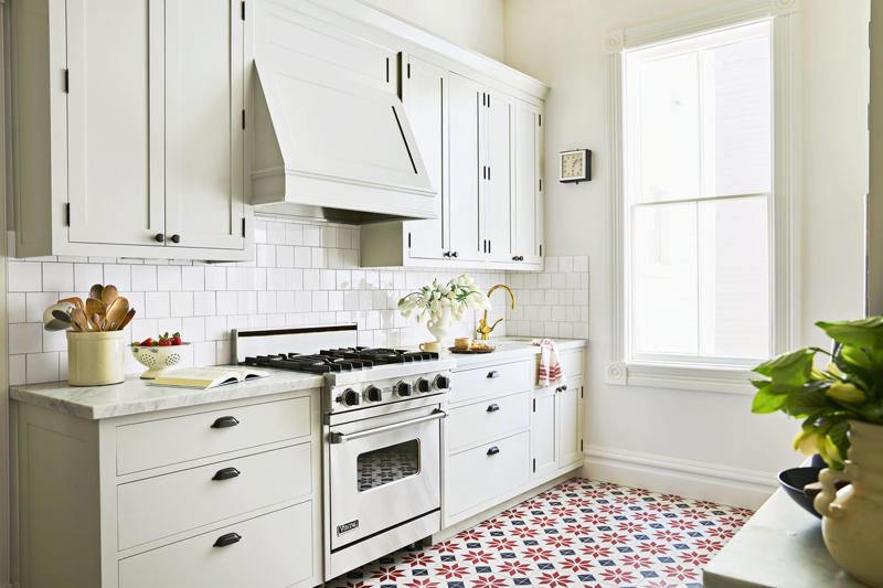 32) Keep it Classic 10) Take a Maximalist Approach, 16) Make the Most of Kitchen Corners, 17) Bring in a Dining Table, 18) Mount a Metal Rack, 20) Keep It Classic, 21) Let Counters Play Double Duty, 24) Install a Pegboard Wall, 25) Add Sleek Open Shelving, 26) Go Big With Art, 29) Infuse Color With Tiles, 34) Add Task Lighting, 36) Go Bold on Top, Neutral on Bottom, 39) Get Smart With Floating Shelves, 40) Keep Most-Used Items on Shelves, 41) Extend Tile from Countertop to Ceiling, 44) Disguise Your Dishwasher, 45) Double up on Pattern and Color, 46) Try Backless Stools, 47) Craft a Wine Nook, 48) Invest in a Rolling Kitchen Cart, 49) Use Vertical Space