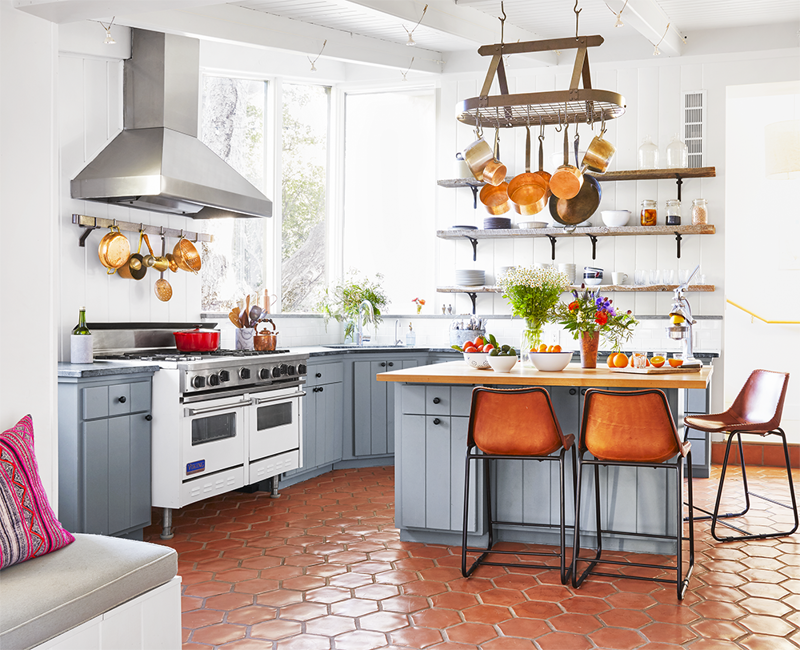 40) Use Vertical Space 10) Take a Maximalist Approach, 16) Make the Most of Kitchen Corners, 17) Bring in a Dining Table, 18) Mount a Metal Rack, 20) Keep It Classic, 21) Let Counters Play Double Duty, 24) Install a Pegboard Wall, 25) Add Sleek Open Shelving, 26) Go Big With Art, 29) Infuse Color With Tiles, 34) Add Task Lighting, 36) Go Bold on Top, Neutral on Bottom, 39) Get Smart With Floating Shelves, 40) Keep Most-Used Items on Shelves, 41) Extend Tile from Countertop to Ceiling, 44) Disguise Your Dishwasher, 45) Double up on Pattern and Color, 46) Try Backless Stools, 47) Craft a Wine Nook, 48) Invest in a Rolling Kitchen Cart, 49) Use Vertical Space