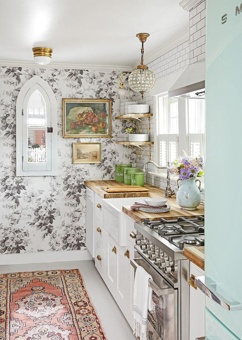 15) Take a Maximalist Approach 10) Take a Maximalist Approach, 16) Make the Most of Kitchen Corners, 17) Bring in a Dining Table, 18) Mount a Metal Rack, 20) Keep It Classic, 21) Let Counters Play Double Duty, 24) Install a Pegboard Wall, 25) Add Sleek Open Shelving, 26) Go Big With Art, 29) Infuse Color With Tiles, 34) Add Task Lighting, 36) Go Bold on Top, Neutral on Bottom, 39) Get Smart With Floating Shelves, 40) Keep Most-Used Items on Shelves, 41) Extend Tile from Countertop to Ceiling, 44) Disguise Your Dishwasher, 45) Double up on Pattern and Color, 46) Try Backless Stools, 47) Craft a Wine Nook, 48) Invest in a Rolling Kitchen Cart, 49) Use Vertical Space