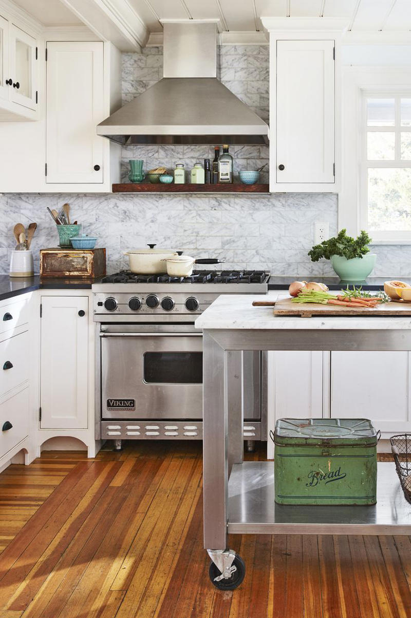 39) Invest in a Rolling Kitchen Cart 10) Take a Maximalist Approach, 16) Make the Most of Kitchen Corners, 17) Bring in a Dining Table, 18) Mount a Metal Rack, 20) Keep It Classic, 21) Let Counters Play Double Duty, 24) Install a Pegboard Wall, 25) Add Sleek Open Shelving, 26) Go Big With Art, 29) Infuse Color With Tiles, 34) Add Task Lighting, 36) Go Bold on Top, Neutral on Bottom, 39) Get Smart With Floating Shelves, 40) Keep Most-Used Items on Shelves, 41) Extend Tile from Countertop to Ceiling, 44) Disguise Your Dishwasher, 45) Double up on Pattern and Color, 46) Try Backless Stools, 47) Craft a Wine Nook, 48) Invest in a Rolling Kitchen Cart, 49) Use Vertical Space