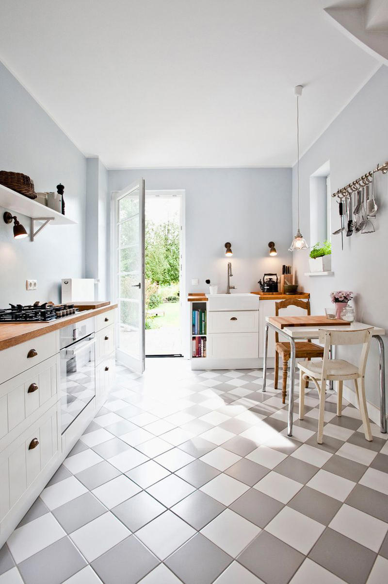 6) Bring in a Dining Table 10) Take a Maximalist Approach, 16) Make the Most of Kitchen Corners, 17) Bring in a Dining Table, 18) Mount a Metal Rack, 20) Keep It Classic, 21) Let Counters Play Double Duty, 24) Install a Pegboard Wall, 25) Add Sleek Open Shelving, 26) Go Big With Art, 29) Infuse Color With Tiles, 34) Add Task Lighting, 36) Go Bold on Top, Neutral on Bottom, 39) Get Smart With Floating Shelves, 40) Keep Most-Used Items on Shelves, 41) Extend Tile from Countertop to Ceiling, 44) Disguise Your Dishwasher, 45) Double up on Pattern and Color, 46) Try Backless Stools, 47) Craft a Wine Nook, 48) Invest in a Rolling Kitchen Cart, 49) Use Vertical Space