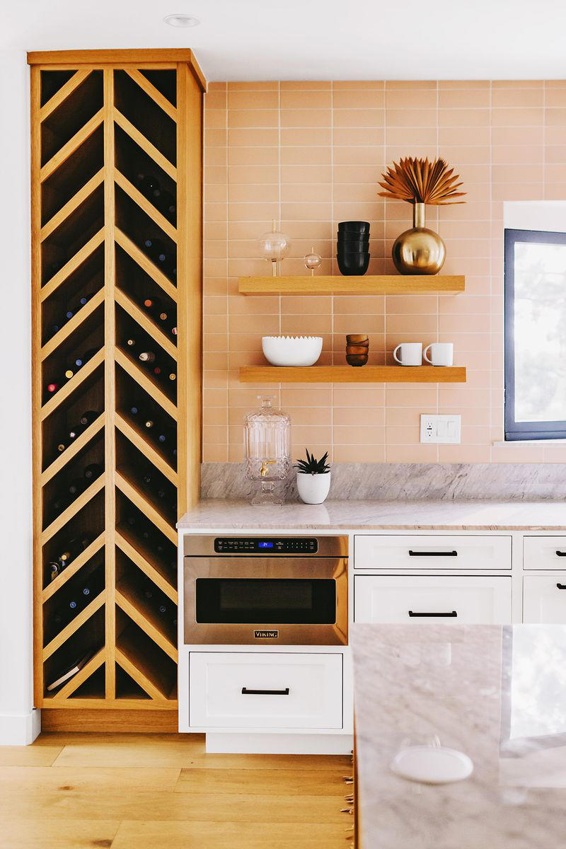 36) Craft a Wine Nook 10) Take a Maximalist Approach, 16) Make the Most of Kitchen Corners, 17) Bring in a Dining Table, 18) Mount a Metal Rack, 20) Keep It Classic, 21) Let Counters Play Double Duty, 24) Install a Pegboard Wall, 25) Add Sleek Open Shelving, 26) Go Big With Art, 29) Infuse Color With Tiles, 34) Add Task Lighting, 36) Go Bold on Top, Neutral on Bottom, 39) Get Smart With Floating Shelves, 40) Keep Most-Used Items on Shelves, 41) Extend Tile from Countertop to Ceiling, 44) Disguise Your Dishwasher, 45) Double up on Pattern and Color, 46) Try Backless Stools, 47) Craft a Wine Nook, 48) Invest in a Rolling Kitchen Cart, 49) Use Vertical Space