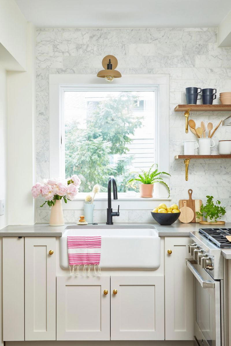 23) Extend Tile from Countertop to Ceiling 10) Take a Maximalist Approach, 16) Make the Most of Kitchen Corners, 17) Bring in a Dining Table, 18) Mount a Metal Rack, 20) Keep It Classic, 21) Let Counters Play Double Duty, 24) Install a Pegboard Wall, 25) Add Sleek Open Shelving, 26) Go Big With Art, 29) Infuse Color With Tiles, 34) Add Task Lighting, 36) Go Bold on Top, Neutral on Bottom, 39) Get Smart With Floating Shelves, 40) Keep Most-Used Items on Shelves, 41) Extend Tile from Countertop to Ceiling, 44) Disguise Your Dishwasher, 45) Double up on Pattern and Color, 46) Try Backless Stools, 47) Craft a Wine Nook, 48) Invest in a Rolling Kitchen Cart, 49) Use Vertical Space