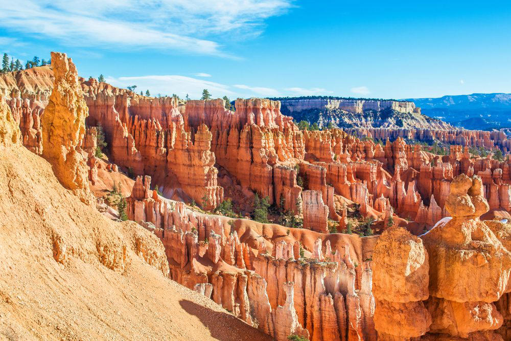 Utah: Bryce Canyon Illinois: Garden of the Gods, Indiana: Indiana Dunes National Lakeshore, Iowa: Maquoketa Caves, Michigan: Kitch-iti-Kipi, Minnesota: Palisade Head, Nebraska: Platte River, North Carolina: Chimney Rock, North Dakota: Theodore Roosevelt National Park, Oregon: Crater Lake, Rhode Island: Mohegan Bluffs, South Carolina: Hunting Island, South Dakota: Badlands National Park, Utah: Bryce Canyon, Vermont: Lake Willoughby, Virginia: Natural Bridge, Washington: Blanca Lake
