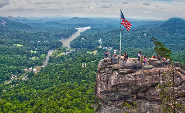 North Carolina: Chimney Rock Illinois: Garden of the Gods, Indiana: Indiana Dunes National Lakeshore, Iowa: Maquoketa Caves, Michigan: Kitch-iti-Kipi, Minnesota: Palisade Head, Nebraska: Platte River, North Carolina: Chimney Rock, North Dakota: Theodore Roosevelt National Park, Oregon: Crater Lake, Rhode Island: Mohegan Bluffs, South Carolina: Hunting Island, South Dakota: Badlands National Park, Utah: Bryce Canyon, Vermont: Lake Willoughby, Virginia: Natural Bridge, Washington: Blanca Lake