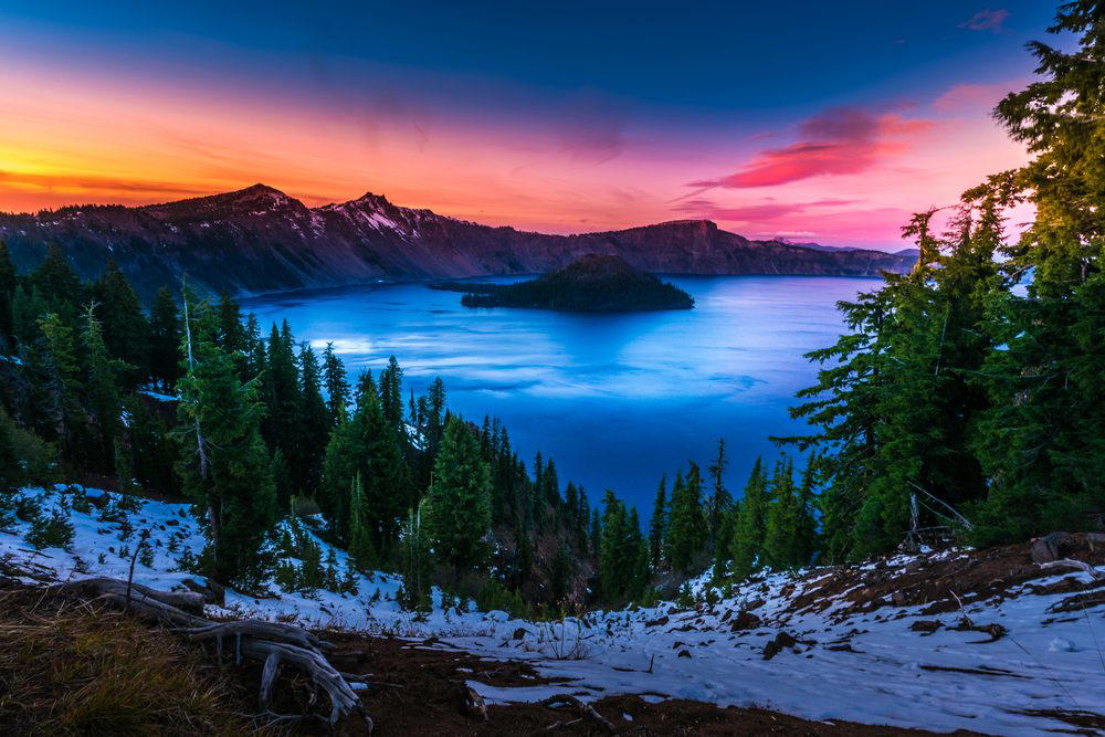 Oregon: Crater Lake Illinois: Garden of the Gods, Indiana: Indiana Dunes National Lakeshore, Iowa: Maquoketa Caves, Michigan: Kitch-iti-Kipi, Minnesota: Palisade Head, Nebraska: Platte River, North Carolina: Chimney Rock, North Dakota: Theodore Roosevelt National Park, Oregon: Crater Lake, Rhode Island: Mohegan Bluffs, South Carolina: Hunting Island, South Dakota: Badlands National Park, Utah: Bryce Canyon, Vermont: Lake Willoughby, Virginia: Natural Bridge, Washington: Blanca Lake