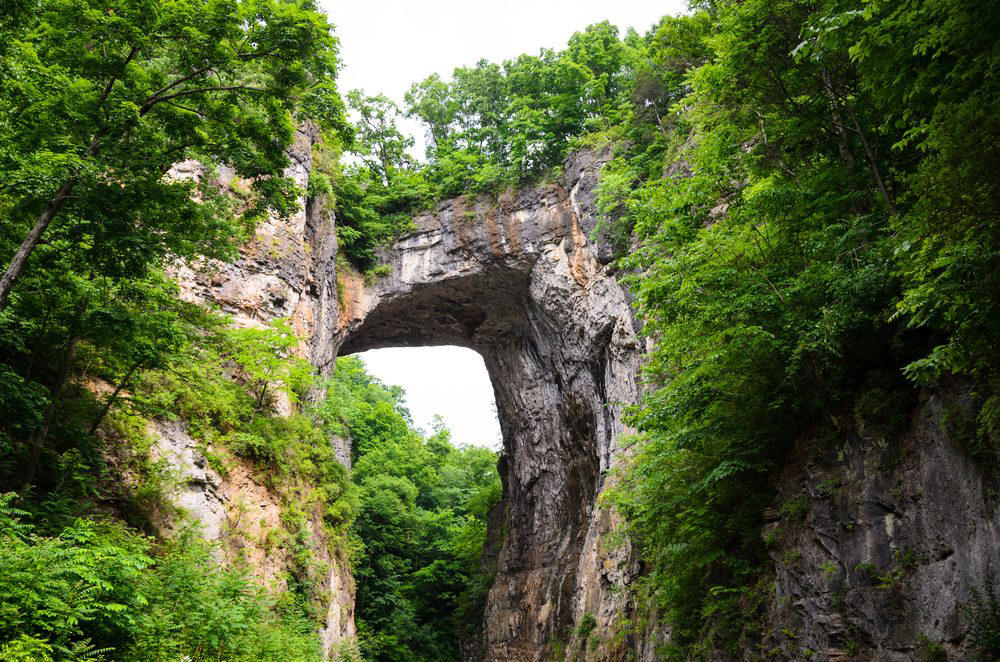 Virginia: Natural Bridge Illinois: Garden of the Gods, Indiana: Indiana Dunes National Lakeshore, Iowa: Maquoketa Caves, Michigan: Kitch-iti-Kipi, Minnesota: Palisade Head, Nebraska: Platte River, North Carolina: Chimney Rock, North Dakota: Theodore Roosevelt National Park, Oregon: Crater Lake, Rhode Island: Mohegan Bluffs, South Carolina: Hunting Island, South Dakota: Badlands National Park, Utah: Bryce Canyon, Vermont: Lake Willoughby, Virginia: Natural Bridge, Washington: Blanca Lake
