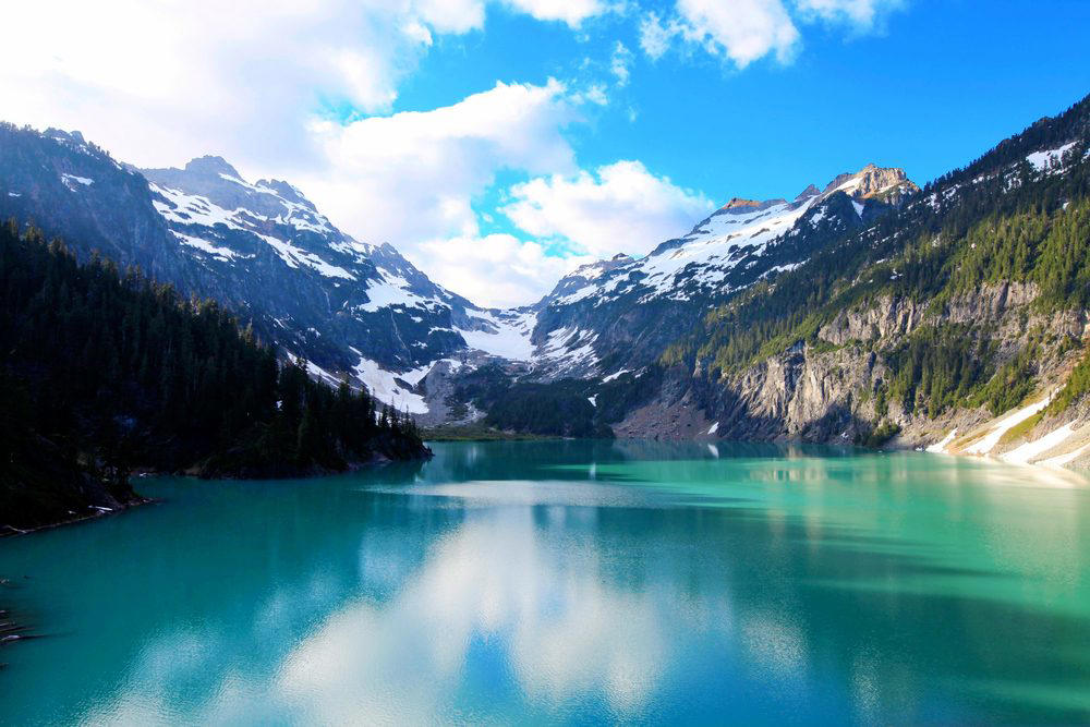 Washington: Blanca Lake Illinois: Garden of the Gods, Indiana: Indiana Dunes National Lakeshore, Iowa: Maquoketa Caves, Michigan: Kitch-iti-Kipi, Minnesota: Palisade Head, Nebraska: Platte River, North Carolina: Chimney Rock, North Dakota: Theodore Roosevelt National Park, Oregon: Crater Lake, Rhode Island: Mohegan Bluffs, South Carolina: Hunting Island, South Dakota: Badlands National Park, Utah: Bryce Canyon, Vermont: Lake Willoughby, Virginia: Natural Bridge, Washington: Blanca Lake