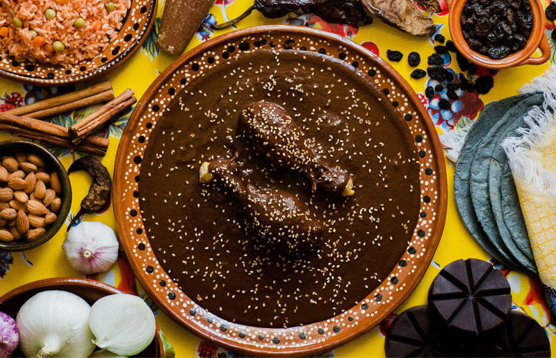 90. Peri peri chicken, Mozambique, 89. Sauerbraten, Germany, 88. Massaman, Thailand, 87. Spanakopita, Cyprus and Greece, 86. Cassoulet, France, 85. Banitsa, Bulgaria, 84. Barramundi, Australia, 83. Pastel de choclo, Chile, 82. Mole, Mexico, 81. Borscht, Ukraine, 80. Plov, Uzbekistan, 79. Bunny chow, South Africa, 78. Käsespätzle/ Käsknöpfle, Central Europe, 77. Chicken rice, Singapore, 76. Adobo, Philippines, 75. Rösti, Switzerland, 74. Falafel, Middle East, 73. Hoppers, Sri Lanka, 72. Nasi lemak, Malaysia, 71. Pupusa, El Salvador, 70. Beef rendang, Indonesia, 69. Tortilla de patatas, Spain, 68. French onion soup, France, 67. Colcannon, Ireland, 66. Bobotie, South Africa, 65. Haggis, Scotland, 64. Tamales, Central and South America, 63. Wiener schnitzel, Austria, 62. Feijoada, Brazil, 61. Souvlaki, Greece, 60. Laksa, Malaysia, 59. Clam chowder, USA, 58. Raclette, Switzerland, 57. Smørrebrød, Denmark, 56. Jollof rice, West Africa, 55. Poutine, Canada, 54. Goulash, Hungary, 53. Pho, Vietnam, 52. Biryani, India, 51. Arepa, Colombia and Venezuela, 50. Shawarma, Middle East, 49. Beef stroganoff, Russia, 48. Som tam, Laos, 47. Cacio e pepe, Italy, 46. Bouillabaisse, France, 45. Khachapuri, Georgia, 44. Ceviche, Peru, 43. Quesadilla, Mexico, 42. Masala dosa, India, 41. Moules frites, Belgium, 40. Köttbullar, Sweden, 39. Welsh rarebit, Wales, 38. Pierogi, Poland, 37. Poke, USA, 36. Tagine, Morocco, 35. Dim sum, China, 34. Gumbo, USA, 33. Kebab, Turkey, 32. Jerk chicken, Jamaica, 31. Singapore noodles, Hong Kong, 30. Asado, Argentina, 29. Beef Wellington, England, 28. Moussaka, Greece, 27. Tahdig, Iran, 26. Murgh makhani, India, 25. Gnocchi, Italy, 24. Sushi, Japan, 23. Texas-style barbecue, USA, 22. Fish and chips, UK, 21. Carbonara, Italy, 20. Tom yum soup, Thailand, 19. Cataplana, Portugal, 18. Mezze, Middle East, 17. Pad Thai, Thailand, 16. Steak frites, France, 15. Shakshuka, Middle East, 14. Tapas, Spain, 13. Gua bao, Taiwan, 12. Boeuf bourguignon, France, 11. Peking duck, China, 10. Chicken parmigiana, USA, 9. Bibimbap, South Korea, 8. Paella, Spain, 7. Tacos, Mexico, 6. Southern fried chicken, USA, 5. Sausage and mash, UK, 4. Ragù alla Bolognese, Italy, 3. Ramen, Japan, 2. Hamburger, USA