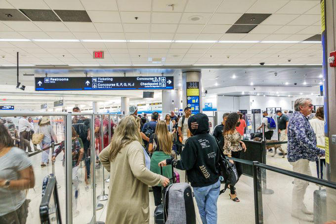 Everyone wants the security line to move faster, including TSA agents, Trying to pet the TSA K9 dog, Handing agents your boarding pass without your ID, Holding up your ID, Crowding the security checkpoint, Asking a TSA agent to check you in for your flight, Talking on your phone the whole time, Bringing the wrong ID, Yelling at them, Telling a bomb joke, Not listening to their directions, Walking your dog on a leash, Letting your kids run wild, Overdressing