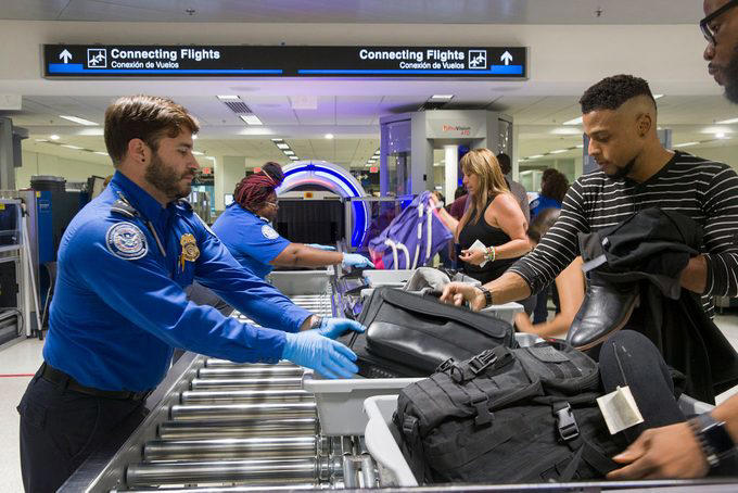Everyone wants the security line to move faster, including TSA agents, Trying to pet the TSA K9 dog, Handing agents your boarding pass without your ID, Holding up your ID, Crowding the security checkpoint, Asking a TSA agent to check you in for your flight, Talking on your phone the whole time, Bringing the wrong ID, Yelling at them, Telling a bomb joke, Not listening to their directions, Walking your dog on a leash, Letting your kids run wild, Overdressing