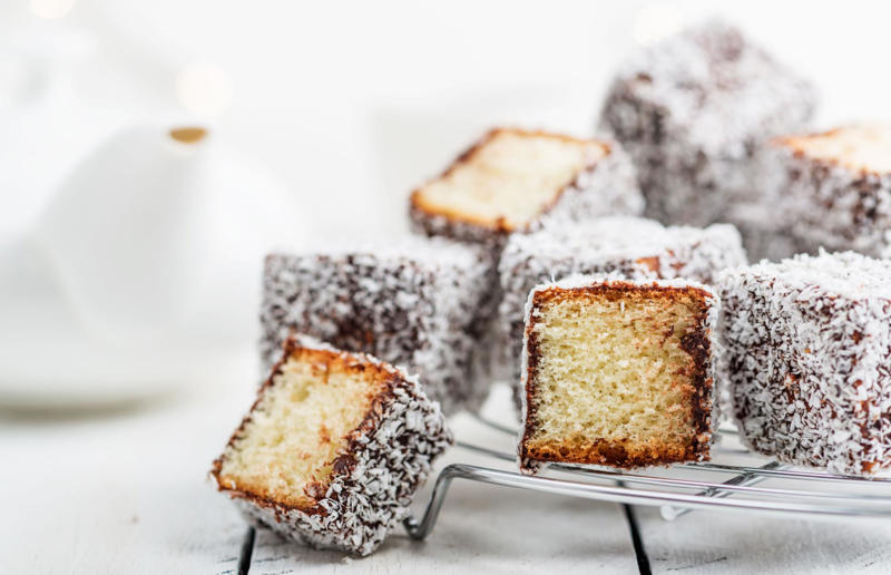 15. Lamingtons, Australia 44. Fondant fancies, England, UK, 43. Castella, Japan, 42. Parkin, England, UK, 41. German chocolate cake, USA, 40. Fraisier, France, 39. Amandine, Romania, 38. Barmbrack, Ireland, 37. Rigó Jancsi, Hungary, 36. Foi thong cake, Thailand, 35. Brigadeiro, Brazil, 34. Hummingbird cake, Jamaica, 33. King cake, USA, 32. Basbousa, Egypt, 31. Dundee cake, Scotland, UK, 30. Angel food cake, USA, 29. Rum cake, Caribbean, 28. Madeira cake, UK, 27. Ice cream cake, various locations, 26. Pineapple upside-down cake, USA, 25. Portokalopita, Greece, 24. Bienenstich, Germany, 23. Persian love cake, Iran, 22. Chajá, Uruguay, 21. Kvæfjordkake, Norway, 20. Tunnel of fudge cake, USA, 19. Malva pudding, South Africa, 18. Jamaican ginger cake, Jamaica and UK, 17. Medovik, Russia, 16. Funfetti cake, USA, 15. Lamingtons, Australia, 14. Battenberg, England, UK, 13. Sachertorte, Austria, 12. Opera cake, France, 11. Maple cake, Canada, 10. Lapis legit, Indonesia, 9. Swiss roll, Central Europe, 8. Banana bread, USA, 7. Lemon drizzle cake, England, UK, 6. Carrot cake, various locations, 5. Schwarzwälder Kirschtorte, Germany, 4. Tres leches cake, Latin America, 3. Victoria sponge, England, UK, 2. Red velvet cake, USA