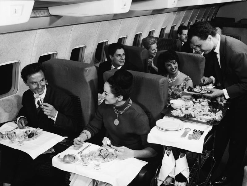 Reclining seats included footrests and leaned almost all the way back., The first-class cabin's gourmet dining remained., Flutes of Champagne were an added bonus., Spiral staircases led to the 747's upper deck lounge., Some early jumbo jets were even equipped with pianos., The massive double-decker entered service with Singapore Airlines in 2007., Two suites could even be merged to create a couple's suite., Emirates has also launched its own first-class suites., Amenities include access to an in-flight shower., However, the ultimate first-class experience comes courtesy of Etihad., Each 125-square-foot, three-room suite features an en suite bathroom with a shower., It also includes a private bedroom and a personal butler., Two suites can be joined to create a two-passenger mega-suite.