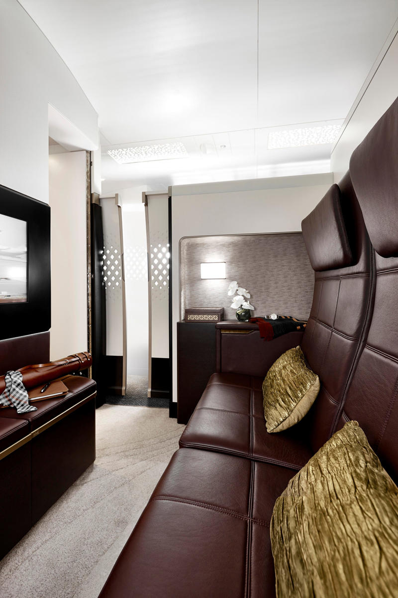 Reclining seats included footrests and leaned almost all the way back., The first-class cabin's gourmet dining remained., Flutes of Champagne were an added bonus., Spiral staircases led to the 747's upper deck lounge., Some early jumbo jets were even equipped with pianos., The massive double-decker entered service with Singapore Airlines in 2007., Two suites could even be merged to create a couple's suite., Emirates has also launched its own first-class suites., Amenities include access to an in-flight shower., However, the ultimate first-class experience comes courtesy of Etihad., Each 125-square-foot, three-room suite features an en suite bathroom with a shower., It also includes a private bedroom and a personal butler., Two suites can be joined to create a two-passenger mega-suite.