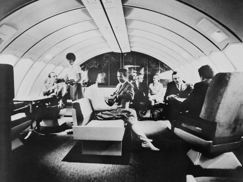 Reclining seats included footrests and leaned almost all the way back., The first-class cabin's gourmet dining remained., Flutes of Champagne were an added bonus., Spiral staircases led to the 747's upper deck lounge., Some early jumbo jets were even equipped with pianos., The massive double-decker entered service with Singapore Airlines in 2007., Two suites could even be merged to create a couple's suite., Emirates has also launched its own first-class suites., Amenities include access to an in-flight shower., However, the ultimate first-class experience comes courtesy of Etihad., Each 125-square-foot, three-room suite features an en suite bathroom with a shower., It also includes a private bedroom and a personal butler., Two suites can be joined to create a two-passenger mega-suite.