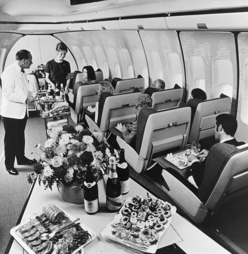 Reclining seats included footrests and leaned almost all the way back., The first-class cabin's gourmet dining remained., Flutes of Champagne were an added bonus., Spiral staircases led to the 747's upper deck lounge., Some early jumbo jets were even equipped with pianos., The massive double-decker entered service with Singapore Airlines in 2007., Two suites could even be merged to create a couple's suite., Emirates has also launched its own first-class suites., Amenities include access to an in-flight shower., However, the ultimate first-class experience comes courtesy of Etihad., Each 125-square-foot, three-room suite features an en suite bathroom with a shower., It also includes a private bedroom and a personal butler., Two suites can be joined to create a two-passenger mega-suite.