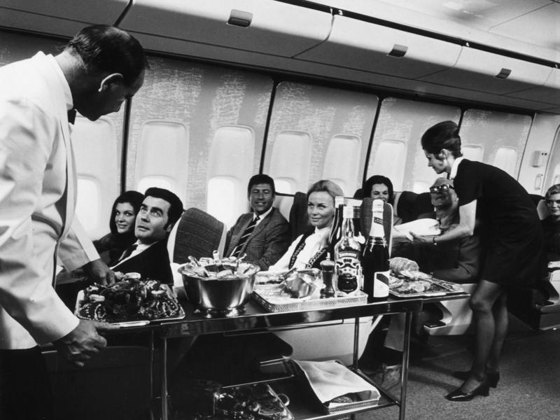 Reclining seats included footrests and leaned almost all the way back., The first-class cabin's gourmet dining remained., Flutes of Champagne were an added bonus., Spiral staircases led to the 747's upper deck lounge., Some early jumbo jets were even equipped with pianos., The massive double-decker entered service with Singapore Airlines in 2007., Two suites could even be merged to create a couple's suite., Emirates has also launched its own first-class suites., Amenities include access to an in-flight shower., However, the ultimate first-class experience comes courtesy of Etihad., Each 125-square-foot, three-room suite features an en suite bathroom with a shower., It also includes a private bedroom and a personal butler., Two suites can be joined to create a two-passenger mega-suite.