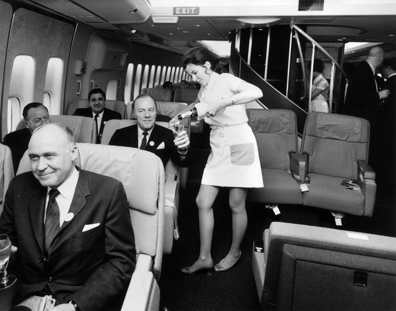 Reclining seats included footrests and leaned almost all the way back., The first-class cabin's gourmet dining remained., Flutes of Champagne were an added bonus., Spiral staircases led to the 747's upper deck lounge., Some early jumbo jets were even equipped with pianos., The massive double-decker entered service with Singapore Airlines in 2007., Two suites could even be merged to create a couple's suite., Emirates has also launched its own first-class suites., Amenities include access to an in-flight shower., However, the ultimate first-class experience comes courtesy of Etihad., Each 125-square-foot, three-room suite features an en suite bathroom with a shower., It also includes a private bedroom and a personal butler., Two suites can be joined to create a two-passenger mega-suite.