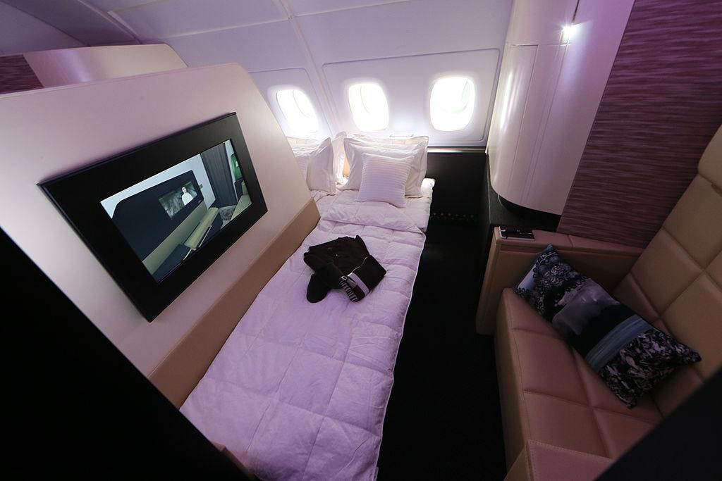 Reclining seats included footrests and leaned almost all the way back., The first-class cabin's gourmet dining remained., Flutes of Champagne were an added bonus., Spiral staircases led to the 747's upper deck lounge., Some early jumbo jets were even equipped with pianos., The massive double-decker entered service with Singapore Airlines in 2007., Two suites could even be merged to create a couple's suite., Emirates has also launched its own first-class suites., Amenities include access to an in-flight shower., However, the ultimate first-class experience comes courtesy of Etihad., Each 125-square-foot, three-room suite features an en suite bathroom with a shower., It also includes a private bedroom and a personal butler., Two suites can be joined to create a two-passenger mega-suite.