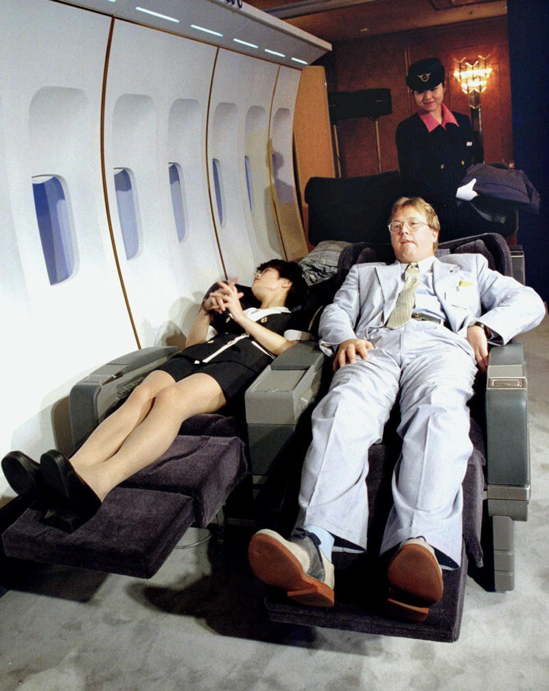Reclining seats included footrests and leaned almost all the way back., The first-class cabin's gourmet dining remained., Flutes of Champagne were an added bonus., Spiral staircases led to the 747's upper deck lounge., Some early jumbo jets were even equipped with pianos., The massive double-decker entered service with Singapore Airlines in 2007., Two suites could even be merged to create a couple's suite., Emirates has also launched its own first-class suites., Amenities include access to an in-flight shower., However, the ultimate first-class experience comes courtesy of Etihad., Each 125-square-foot, three-room suite features an en suite bathroom with a shower., It also includes a private bedroom and a personal butler., Two suites can be joined to create a two-passenger mega-suite.
