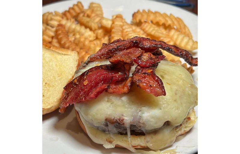 Minnesota: Millionaire Bacon Burger, Granite City Food & Brewery, various locations Bacon with EVERYTHING, Alabama: BALT, Urban Cookhouse, various locations, Alaska: Fat Elvis milkshake, Snow City Cafe, Anchorage, Arizona: stuffed Medjool dates, J.T. Prime Kitchen & Cocktails, Yuma, Arkansas: Eggniter, Golden Kolache Bakery, Fayetteville, California: B’B’B’ Bacon, Slater's 50/50, various locations, Colorado: signature bacon flight, Bacon Social House, various locations, Connecticut: smoked mac & cheese, Pig Rig BBQ, Wallingford, Delaware: bacon cheese fries, m2o Burgers & Salads, Newark, District of Columbia: glazed bacon lollis, Founding Farmers, various locations, Florida: candied bacon maple ice cream, Ulele, Tampa, Georgia: BBQ bacon, Burger 21, Kennesaw and Buford, Hawaii: Fat Boy, Hank's Haute Dogs, Honolulu, Idaho: bacon, egg, and cheese breakfast tacos, Tin Roof Tacos, various locations, Illinois: cheeseburger, Au Cheval, Chicago, Indiana: BLT croissant, Rize, various locations, Iowa: pancake sandwich, The Breakfast Club, various locations, Kansas: bleu cheese and bacon burger, The Anchor, Wichita, Kentucky: maple bacon donut, Nord's Bakery, Louisville, Louisiana: Buckboard Bacon Melt, Cochon Butcher, New Orleans, Maine: bacon Cheddar, The Holy Donut, Portland, Maryland: Baltimore Burger, Abbey Burger Bistro, Baltimore and Havre de Grace, Massachusetts: 'Irish' nachos, Harry's Bar & Grill, Boston, Michigan: BLT, Tony’s I-75, Birch Run, Minnesota: Millionaire bacon burger, Granite City Food & Brewery, various locations, Mississippi: Redneck Benny, Big Bad Breakfast, Oxford, Missouri: The Combo, Songbird, St. Louis, Montana: The 'Mazatlan' Mexican Dog, The Burger Dive, Billings, Nebraska: Greatest Burger Ever, Honest Abe’s Burgers & Freedom, Lincoln, Nebraska, Nevada: 24K Burger, Slater's 50/50, Las Vegas, New Hampshire: Bacon Bene, The Bacon Barn, Londonderry, New Jersey: bacon brisket sandwich, Bake'n Bacon, Cape May, New Mexico: BB&C, Urban Hotdog Company, Albuquerque, New York: Clothesline Bacon, David Burke Tavern, New York City, North Carolina: BLT, Merritt's Grill, Chapel Hill, North Dakota: The Elvis, Bearscat Bakehouse, Bismarck and Minot, Ohio: Biscuit BLT, Dough Mama, Columbus, Oklahoma: Brussels sprouts, Packard’s, Oklahoma City, Oregon: praline bacon, Screen Door, Portland, Pennsylvania: bacon flight, Bacon, Bourbon & Beer, Washington, Rhode Island: BLT, The Malted Barley, Providence, South Carolina: candied bacon brownie, Nose Dive, Greenville, South Dakota: bacon wrapped filet mignon, Alpine Inn, Hill City, Tennessee: Southern Sampler Breakfast, The Loveless Cafe, Nashville, Texas: chicken fried bacon, Sodolak's Original Country Inn, Snook, Utah: roasted bacon wrapped dates, Midway Mercantile Restaurant, Midway, Vermont: Breakfast Mac, Our House Bistro, Winooski, Virginia: Mother Clucker, Capitol Waffle Shop, various locations, Washington: Meatza, Windy City Pie, Seattle, West Virginia: hot chicken sandwich with bacon, Wood Iron Eatery, Fayetteville, Wisconsin: tequila jam burger, 11:11 Burgers & Beignets, Fond Du Lac, Wisconsin