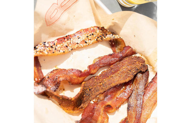 Colorado: Signature Bacon Flight, Bacon Social House, various locations Bacon with EVERYTHING, Alabama: BALT, Urban Cookhouse, various locations, Alaska: Fat Elvis milkshake, Snow City Cafe, Anchorage, Arizona: stuffed Medjool dates, J.T. Prime Kitchen & Cocktails, Yuma, Arkansas: Eggniter, Golden Kolache Bakery, Fayetteville, California: B’B’B’ Bacon, Slater's 50/50, various locations, Colorado: signature bacon flight, Bacon Social House, various locations, Connecticut: smoked mac & cheese, Pig Rig BBQ, Wallingford, Delaware: bacon cheese fries, m2o Burgers & Salads, Newark, District of Columbia: glazed bacon lollis, Founding Farmers, various locations, Florida: candied bacon maple ice cream, Ulele, Tampa, Georgia: BBQ bacon, Burger 21, Kennesaw and Buford, Hawaii: Fat Boy, Hank's Haute Dogs, Honolulu, Idaho: bacon, egg, and cheese breakfast tacos, Tin Roof Tacos, various locations, Illinois: cheeseburger, Au Cheval, Chicago, Indiana: BLT croissant, Rize, various locations, Iowa: pancake sandwich, The Breakfast Club, various locations, Kansas: bleu cheese and bacon burger, The Anchor, Wichita, Kentucky: maple bacon donut, Nord's Bakery, Louisville, Louisiana: Buckboard Bacon Melt, Cochon Butcher, New Orleans, Maine: bacon Cheddar, The Holy Donut, Portland, Maryland: Baltimore Burger, Abbey Burger Bistro, Baltimore and Havre de Grace, Massachusetts: 'Irish' nachos, Harry's Bar & Grill, Boston, Michigan: BLT, Tony’s I-75, Birch Run, Minnesota: Millionaire bacon burger, Granite City Food & Brewery, various locations, Mississippi: Redneck Benny, Big Bad Breakfast, Oxford, Missouri: The Combo, Songbird, St. Louis, Montana: The 'Mazatlan' Mexican Dog, The Burger Dive, Billings, Nebraska: Greatest Burger Ever, Honest Abe’s Burgers & Freedom, Lincoln, Nebraska, Nevada: 24K Burger, Slater's 50/50, Las Vegas, New Hampshire: Bacon Bene, The Bacon Barn, Londonderry, New Jersey: bacon brisket sandwich, Bake'n Bacon, Cape May, New Mexico: BB&C, Urban Hotdog Company, Albuquerque, New York: Clothesline Bacon, David Burke Tavern, New York City, North Carolina: BLT, Merritt's Grill, Chapel Hill, North Dakota: The Elvis, Bearscat Bakehouse, Bismarck and Minot, Ohio: Biscuit BLT, Dough Mama, Columbus, Oklahoma: Brussels sprouts, Packard’s, Oklahoma City, Oregon: praline bacon, Screen Door, Portland, Pennsylvania: bacon flight, Bacon, Bourbon & Beer, Washington, Rhode Island: BLT, The Malted Barley, Providence, South Carolina: candied bacon brownie, Nose Dive, Greenville, South Dakota: bacon wrapped filet mignon, Alpine Inn, Hill City, Tennessee: Southern Sampler Breakfast, The Loveless Cafe, Nashville, Texas: chicken fried bacon, Sodolak's Original Country Inn, Snook, Utah: roasted bacon wrapped dates, Midway Mercantile Restaurant, Midway, Vermont: Breakfast Mac, Our House Bistro, Winooski, Virginia: Mother Clucker, Capitol Waffle Shop, various locations, Washington: Meatza, Windy City Pie, Seattle, West Virginia: hot chicken sandwich with bacon, Wood Iron Eatery, Fayetteville, Wisconsin: tequila jam burger, 11:11 Burgers & Beignets, Fond Du Lac, Wisconsin