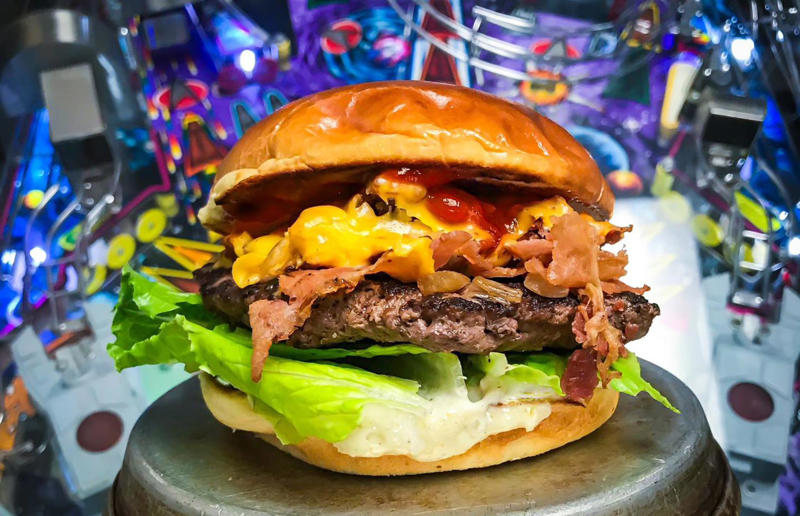 Nebraska: Greatest Burger Ever, Honest Abe’s Burgers & Freedom, Lincoln, Nebraska Bacon with EVERYTHING, Alabama: BALT, Urban Cookhouse, various locations, Alaska: Fat Elvis milkshake, Snow City Cafe, Anchorage, Arizona: stuffed Medjool dates, J.T. Prime Kitchen & Cocktails, Yuma, Arkansas: Eggniter, Golden Kolache Bakery, Fayetteville, California: B’B’B’ Bacon, Slater's 50/50, various locations, Colorado: signature bacon flight, Bacon Social House, various locations, Connecticut: smoked mac & cheese, Pig Rig BBQ, Wallingford, Delaware: bacon cheese fries, m2o Burgers & Salads, Newark, District of Columbia: glazed bacon lollis, Founding Farmers, various locations, Florida: candied bacon maple ice cream, Ulele, Tampa, Georgia: BBQ bacon, Burger 21, Kennesaw and Buford, Hawaii: Fat Boy, Hank's Haute Dogs, Honolulu, Idaho: bacon, egg, and cheese breakfast tacos, Tin Roof Tacos, various locations, Illinois: cheeseburger, Au Cheval, Chicago, Indiana: BLT croissant, Rize, various locations, Iowa: pancake sandwich, The Breakfast Club, various locations, Kansas: bleu cheese and bacon burger, The Anchor, Wichita, Kentucky: maple bacon donut, Nord's Bakery, Louisville, Louisiana: Buckboard Bacon Melt, Cochon Butcher, New Orleans, Maine: bacon Cheddar, The Holy Donut, Portland, Maryland: Baltimore Burger, Abbey Burger Bistro, Baltimore and Havre de Grace, Massachusetts: 'Irish' nachos, Harry's Bar & Grill, Boston, Michigan: BLT, Tony’s I-75, Birch Run, Minnesota: Millionaire bacon burger, Granite City Food & Brewery, various locations, Mississippi: Redneck Benny, Big Bad Breakfast, Oxford, Missouri: The Combo, Songbird, St. Louis, Montana: The 'Mazatlan' Mexican Dog, The Burger Dive, Billings, Nebraska: Greatest Burger Ever, Honest Abe’s Burgers & Freedom, Lincoln, Nebraska, Nevada: 24K Burger, Slater's 50/50, Las Vegas, New Hampshire: Bacon Bene, The Bacon Barn, Londonderry, New Jersey: bacon brisket sandwich, Bake'n Bacon, Cape May, New Mexico: BB&C, Urban Hotdog Company, Albuquerque, New York: Clothesline Bacon, David Burke Tavern, New York City, North Carolina: BLT, Merritt's Grill, Chapel Hill, North Dakota: The Elvis, Bearscat Bakehouse, Bismarck and Minot, Ohio: Biscuit BLT, Dough Mama, Columbus, Oklahoma: Brussels sprouts, Packard’s, Oklahoma City, Oregon: praline bacon, Screen Door, Portland, Pennsylvania: bacon flight, Bacon, Bourbon & Beer, Washington, Rhode Island: BLT, The Malted Barley, Providence, South Carolina: candied bacon brownie, Nose Dive, Greenville, South Dakota: bacon wrapped filet mignon, Alpine Inn, Hill City, Tennessee: Southern Sampler Breakfast, The Loveless Cafe, Nashville, Texas: chicken fried bacon, Sodolak's Original Country Inn, Snook, Utah: roasted bacon wrapped dates, Midway Mercantile Restaurant, Midway, Vermont: Breakfast Mac, Our House Bistro, Winooski, Virginia: Mother Clucker, Capitol Waffle Shop, various locations, Washington: Meatza, Windy City Pie, Seattle, West Virginia: hot chicken sandwich with bacon, Wood Iron Eatery, Fayetteville, Wisconsin: tequila jam burger, 11:11 Burgers & Beignets, Fond Du Lac, Wisconsin