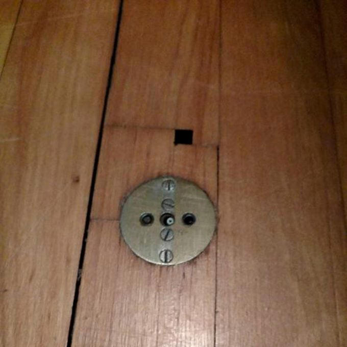 Brass Cylinder with Handle Next to Tub, Metal Plates on Old Homes, Ice Door, Phone Niche, Tiny Iron Door Leading to the Basement, Some Features in Old Homes are Still Useful!, Landline Phone Jacks, Random Toilet in the Basement, Knob and Tube Wiring, Why Do Old Homes Have a Bed in the Ceiling?, Push-Button Light Switch, Hoosier Cabinet, Boot Scraper, Root Cellar, Razor Slit in Medicine Cabinet, Dumbwaiter, Servant Staircase, Servant Floor Button, Milk Door, Old Homes Often Have Transom Windows, Picture Hanging Molding