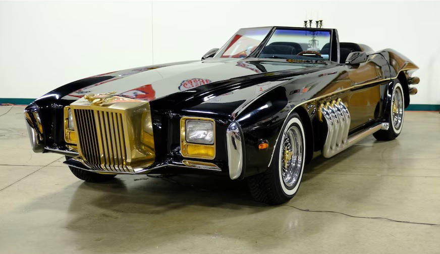 The Barrister All Hail The King Of The Kustomizers, Barris' Ferrari 308 GTS, Barris' Ferrari 308 GTS (cont’d), T Buggy Prototype, T Buggy Prototype (cont’d), Bill Carr’s 1955 Chevrolet “Aztec”, Bill Carr’s 1955 Chevrolet “Aztec” (cont’d), Munster Koach, Munster Koach (cont’d), 1966 Batmobile, 1966 Batmobile (cont’d), Ala Kart, Ala Kart (cont’d), 1998 Mercury Cougar “Woodie” 2050, 1998 Mercury Cougar “Woodie” 2050 (cont’d), The Barrister, The Barrister (cont’d), Bob Nordskog's 1963 "Asteroid" Corvette, Bob Nordskog's 1963 "Asteroid" Corvette (cont’d), Barris’ 1975 SnakePit, Barris’ 1975 SnakePit (cont’d), 1958 Custom Corvette, 1958 Custom Corvette (cont’d), Jurassic Park Tour Vehicles, Jurassic Park Tour Vehicles (cont’d), The Emperor, The Emperor (cont’d), Voxmobile, Voxmobile (cont’d), Kargoyle, Kargoyle (cont’d)