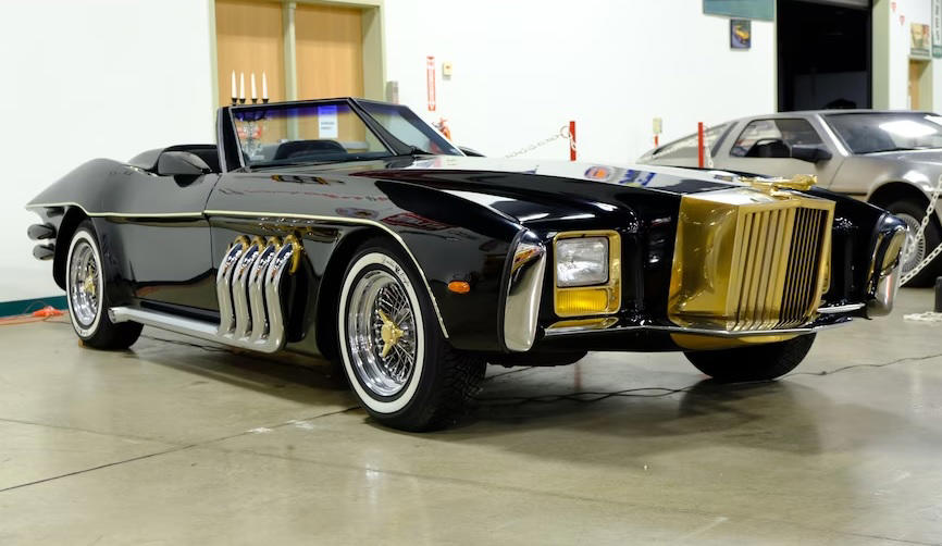 The Barrister (cont’d) All Hail The King Of The Kustomizers, Barris' Ferrari 308 GTS, Barris' Ferrari 308 GTS (cont’d), T Buggy Prototype, T Buggy Prototype (cont’d), Bill Carr’s 1955 Chevrolet “Aztec”, Bill Carr’s 1955 Chevrolet “Aztec” (cont’d), Munster Koach, Munster Koach (cont’d), 1966 Batmobile, 1966 Batmobile (cont’d), Ala Kart, Ala Kart (cont’d), 1998 Mercury Cougar “Woodie” 2050, 1998 Mercury Cougar “Woodie” 2050 (cont’d), The Barrister, The Barrister (cont’d), Bob Nordskog's 1963 "Asteroid" Corvette, Bob Nordskog's 1963 "Asteroid" Corvette (cont’d), Barris’ 1975 SnakePit, Barris’ 1975 SnakePit (cont’d), 1958 Custom Corvette, 1958 Custom Corvette (cont’d), Jurassic Park Tour Vehicles, Jurassic Park Tour Vehicles (cont’d), The Emperor, The Emperor (cont’d), Voxmobile, Voxmobile (cont’d), Kargoyle, Kargoyle (cont’d)
