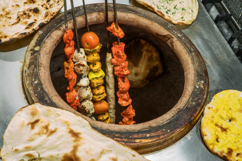 Caribbean barbacoa, Balkan ćevapčići, Argentinian asado, Indian tandoor, Brazilian churrasco, Japanese yakitori, Shawarma, Beer-flavored bratwurst, Turkish lamb kebabs, Greek souvlaki, Jamaican jerk chicken, Yucatán chicken, Italian lamb chops, Japanese shrimp skewers