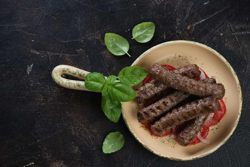 Caribbean barbacoa, Balkan ćevapčići, Argentinian asado, Indian tandoor, Brazilian churrasco, Japanese yakitori, Shawarma, Beer-flavored bratwurst, Turkish lamb kebabs, Greek souvlaki, Jamaican jerk chicken, Yucatán chicken, Italian lamb chops, Japanese shrimp skewers