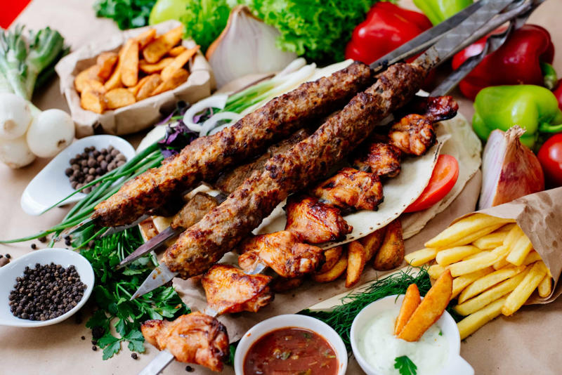 Caribbean barbacoa, Balkan ćevapčići, Argentinian asado, Indian tandoor, Brazilian churrasco, Japanese yakitori, Shawarma, Beer-flavored bratwurst, Turkish lamb kebabs, Greek souvlaki, Jamaican jerk chicken, Yucatán chicken, Italian lamb chops, Japanese shrimp skewers