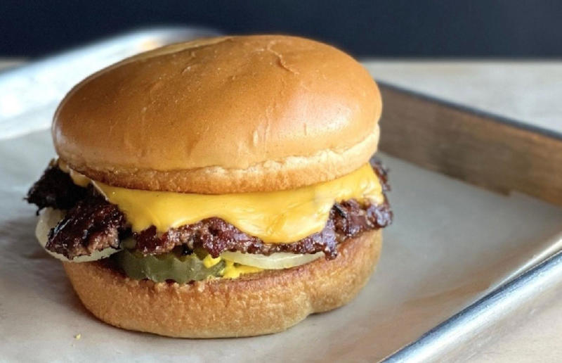 28. Nebraska: The Original, Cheeseburgers, Omaha 54. Tennessee: Dyer's Single, Dyer's Burgers, Memphis, 53. Alabama: hamburger, Dub's Burgers, Athens, 52. Connecticut: The Original Burger, Louis' Lunch, New Haven, 51. California: Steakburger, The Apple Pan, Los Angeles, 50. Iowa: hamburger, B-Bops, various locations, 49. Maine: hamburger, Black Cow, Portland, 48. New Jersey: hamburger, White Manna, Hackensack, 47. New Hampshire: hamburger, Gilley’s Diner, Portsmouth, 46. Massachusetts: Hamburg, White Hut, West Springfield, 45. California: hamburger, In-N-Out Burger, various locations, 44. District of Columbia: Farmhouse Burger, Good Stuff Eatery, Georgetown, 43. Mississippi: Slugburger, Latham's Hamburger Inn, New Albany, 42. Utah: Big Ben, Burger Bar, Roy, 41. Wisconsin: hamburger, Sobelman's Pub & Grill, Milwaukee, 40. Wyoming: The Liberty Burger, Liberty Burger, Jackson, 39. Illinois: House-blend prime beef burger, Butcher & The Burger, Chicago, 38. Arizona: The Standard at The Stand Arcadia Burger Shoppe, Phoenix, 37. Colorado: Cricket Burger, The Cherry Cricket, Denver, 36. New York: Luger burger, Peter Luger Steakhouse, New York City, 35. Delaware: FTC, Farmer & the Cow, Wilmington, 34. Minnesota: Jucy Lucy, Matt’s Bar, Minneapolis, 33. Pennsylvania: hamburger, M2O Burgers & Salads, Philadelphia, 32. South Carolina: Classic, Big Gun Burger Shop, Charleston, 31. Idaho: The Classic, Holy Cow!, Nampa, 30. Kansas: House Burger, Dempsey's Burger Pub, Wichita, 29. Missouri: hamburger, Town Topic, Kansas City, 28. Nebraska: The Original, Cheeseburgers, Omaha, 27. New Mexico: Rustic, Rustic On The Green, Albuquerque, 26. Indiana: Smash burger, Workingman’s Friend, Indianapolis, 25. Vermont: Worthy Burger, Worthy Burger, South Royalton and Woodstock, 24. Arkansas: traditional hamburger, Hugo's, Fayetteville, 23. Texas: Tookie's Burger, Tookie's Hamburgers & More, Kemah, 22. Nevada: Plain Jane, Beefy's, Reno, 21. Georgia: Green Truck Classic, Green Truck Pub, Savannah, 20. New York: hamburger, All-American Hamburger Drive-In, Massapequa, 19. North Dakota: Carport, Sickies Garage Burgers & Brews, various locations, 18. Michigan: sliders, Motz’s Burgers, Detroit, 17. Michigan: Ground Round, Miller’s Bar, Dearborn, 16. Florida: hamburger, Mac's Drive-Thru, Gainesville, 15. West Virginia: Oscar, Oscar’s Breakfast, Burgers & Brews, Barboursville, 14. North Carolina: hamburger, Brooks’ Sandwich House, Charlotte, 13. Kentucky: The Purist, Bard's Burgers & Chili, Covington, 12. Maryland: Hamburger, Burger Bros., Towson, 11. Oklahoma: single onion burger, Tucker's Onion Burgers, various locations, 10. Rhode Island: Stanley Burger, Stanley’s Famous Hamburgers, Central Falls, 9. Virginia: Beauvine, Beauvine Burger Concept, Richmond, 8. Oregon: The Original 100, Hwy 101 Burger, Lincoln City, 7. Ohio: hamburger, Kewpee Hamburgers, Lima, 6. Hawaii: hamburger, Kua Aina Sandwich Shop, Haleiwa, 5. Alaska: The Burger Stop, Tommy's Burger Stop, Anchorage, 4. Montana: Hamburger, The Burger Drive, Billings, 3. Washington: Seattle Classic, Von's 1000 Spirits, Seattle, 2. Louisiana: Butcher Burger, Cochon Butcher, New Orleans
