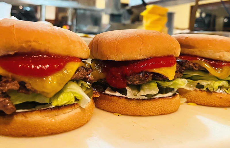 51. California: Steakburger, The Apple Pan, Los Angeles 54. Tennessee: Dyer's Single, Dyer's Burgers, Memphis, 53. Alabama: hamburger, Dub's Burgers, Athens, 52. Connecticut: The Original Burger, Louis' Lunch, New Haven, 51. California: Steakburger, The Apple Pan, Los Angeles, 50. Iowa: hamburger, B-Bops, various locations, 49. Maine: hamburger, Black Cow, Portland, 48. New Jersey: hamburger, White Manna, Hackensack, 47. New Hampshire: hamburger, Gilley’s Diner, Portsmouth, 46. Massachusetts: Hamburg, White Hut, West Springfield, 45. California: hamburger, In-N-Out Burger, various locations, 44. District of Columbia: Farmhouse Burger, Good Stuff Eatery, Georgetown, 43. Mississippi: Slugburger, Latham's Hamburger Inn, New Albany, 42. Utah: Big Ben, Burger Bar, Roy, 41. Wisconsin: hamburger, Sobelman's Pub & Grill, Milwaukee, 40. Wyoming: The Liberty Burger, Liberty Burger, Jackson, 39. Illinois: House-blend prime beef burger, Butcher & The Burger, Chicago, 38. Arizona: The Standard at The Stand Arcadia Burger Shoppe, Phoenix, 37. Colorado: Cricket Burger, The Cherry Cricket, Denver, 36. New York: Luger burger, Peter Luger Steakhouse, New York City, 35. Delaware: FTC, Farmer & the Cow, Wilmington, 34. Minnesota: Jucy Lucy, Matt’s Bar, Minneapolis, 33. Pennsylvania: hamburger, M2O Burgers & Salads, Philadelphia, 32. South Carolina: Classic, Big Gun Burger Shop, Charleston, 31. Idaho: The Classic, Holy Cow!, Nampa, 30. Kansas: House Burger, Dempsey's Burger Pub, Wichita, 29. Missouri: hamburger, Town Topic, Kansas City, 28. Nebraska: The Original, Cheeseburgers, Omaha, 27. New Mexico: Rustic, Rustic On The Green, Albuquerque, 26. Indiana: Smash burger, Workingman’s Friend, Indianapolis, 25. Vermont: Worthy Burger, Worthy Burger, South Royalton and Woodstock, 24. Arkansas: traditional hamburger, Hugo's, Fayetteville, 23. Texas: Tookie's Burger, Tookie's Hamburgers & More, Kemah, 22. Nevada: Plain Jane, Beefy's, Reno, 21. Georgia: Green Truck Classic, Green Truck Pub, Savannah, 20. New York: hamburger, All-American Hamburger Drive-In, Massapequa, 19. North Dakota: Carport, Sickies Garage Burgers & Brews, various locations, 18. Michigan: sliders, Motz’s Burgers, Detroit, 17. Michigan: Ground Round, Miller’s Bar, Dearborn, 16. Florida: hamburger, Mac's Drive-Thru, Gainesville, 15. West Virginia: Oscar, Oscar’s Breakfast, Burgers & Brews, Barboursville, 14. North Carolina: hamburger, Brooks’ Sandwich House, Charlotte, 13. Kentucky: The Purist, Bard's Burgers & Chili, Covington, 12. Maryland: Hamburger, Burger Bros., Towson, 11. Oklahoma: single onion burger, Tucker's Onion Burgers, various locations, 10. Rhode Island: Stanley Burger, Stanley’s Famous Hamburgers, Central Falls, 9. Virginia: Beauvine, Beauvine Burger Concept, Richmond, 8. Oregon: The Original 100, Hwy 101 Burger, Lincoln City, 7. Ohio: hamburger, Kewpee Hamburgers, Lima, 6. Hawaii: hamburger, Kua Aina Sandwich Shop, Haleiwa, 5. Alaska: The Burger Stop, Tommy's Burger Stop, Anchorage, 4. Montana: Hamburger, The Burger Drive, Billings, 3. Washington: Seattle Classic, Von's 1000 Spirits, Seattle, 2. Louisiana: Butcher Burger, Cochon Butcher, New Orleans