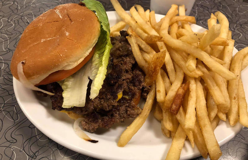 29. Missouri: hamburger, Town Topic, Kansas City 54. Tennessee: Dyer's Single, Dyer's Burgers, Memphis, 53. Alabama: hamburger, Dub's Burgers, Athens, 52. Connecticut: The Original Burger, Louis' Lunch, New Haven, 51. California: Steakburger, The Apple Pan, Los Angeles, 50. Iowa: hamburger, B-Bops, various locations, 49. Maine: hamburger, Black Cow, Portland, 48. New Jersey: hamburger, White Manna, Hackensack, 47. New Hampshire: hamburger, Gilley’s Diner, Portsmouth, 46. Massachusetts: Hamburg, White Hut, West Springfield, 45. California: hamburger, In-N-Out Burger, various locations, 44. District of Columbia: Farmhouse Burger, Good Stuff Eatery, Georgetown, 43. Mississippi: Slugburger, Latham's Hamburger Inn, New Albany, 42. Utah: Big Ben, Burger Bar, Roy, 41. Wisconsin: hamburger, Sobelman's Pub & Grill, Milwaukee, 40. Wyoming: The Liberty Burger, Liberty Burger, Jackson, 39. Illinois: House-blend prime beef burger, Butcher & The Burger, Chicago, 38. Arizona: The Standard at The Stand Arcadia Burger Shoppe, Phoenix, 37. Colorado: Cricket Burger, The Cherry Cricket, Denver, 36. New York: Luger burger, Peter Luger Steakhouse, New York City, 35. Delaware: FTC, Farmer & the Cow, Wilmington, 34. Minnesota: Jucy Lucy, Matt’s Bar, Minneapolis, 33. Pennsylvania: hamburger, M2O Burgers & Salads, Philadelphia, 32. South Carolina: Classic, Big Gun Burger Shop, Charleston, 31. Idaho: The Classic, Holy Cow!, Nampa, 30. Kansas: House Burger, Dempsey's Burger Pub, Wichita, 29. Missouri: hamburger, Town Topic, Kansas City, 28. Nebraska: The Original, Cheeseburgers, Omaha, 27. New Mexico: Rustic, Rustic On The Green, Albuquerque, 26. Indiana: Smash burger, Workingman’s Friend, Indianapolis, 25. Vermont: Worthy Burger, Worthy Burger, South Royalton and Woodstock, 24. Arkansas: traditional hamburger, Hugo's, Fayetteville, 23. Texas: Tookie's Burger, Tookie's Hamburgers & More, Kemah, 22. Nevada: Plain Jane, Beefy's, Reno, 21. Georgia: Green Truck Classic, Green Truck Pub, Savannah, 20. New York: hamburger, All-American Hamburger Drive-In, Massapequa, 19. North Dakota: Carport, Sickies Garage Burgers & Brews, various locations, 18. Michigan: sliders, Motz’s Burgers, Detroit, 17. Michigan: Ground Round, Miller’s Bar, Dearborn, 16. Florida: hamburger, Mac's Drive-Thru, Gainesville, 15. West Virginia: Oscar, Oscar’s Breakfast, Burgers & Brews, Barboursville, 14. North Carolina: hamburger, Brooks’ Sandwich House, Charlotte, 13. Kentucky: The Purist, Bard's Burgers & Chili, Covington, 12. Maryland: Hamburger, Burger Bros., Towson, 11. Oklahoma: single onion burger, Tucker's Onion Burgers, various locations, 10. Rhode Island: Stanley Burger, Stanley’s Famous Hamburgers, Central Falls, 9. Virginia: Beauvine, Beauvine Burger Concept, Richmond, 8. Oregon: The Original 100, Hwy 101 Burger, Lincoln City, 7. Ohio: hamburger, Kewpee Hamburgers, Lima, 6. Hawaii: hamburger, Kua Aina Sandwich Shop, Haleiwa, 5. Alaska: The Burger Stop, Tommy's Burger Stop, Anchorage, 4. Montana: Hamburger, The Burger Drive, Billings, 3. Washington: Seattle Classic, Von's 1000 Spirits, Seattle, 2. Louisiana: Butcher Burger, Cochon Butcher, New Orleans