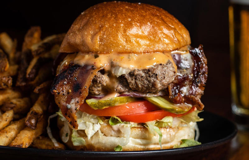 3. Washington: Seattle Classic, Von's 1000 Spirits, Seattle 54. Tennessee: Dyer's Single, Dyer's Burgers, Memphis, 53. Alabama: hamburger, Dub's Burgers, Athens, 52. Connecticut: The Original Burger, Louis' Lunch, New Haven, 51. California: Steakburger, The Apple Pan, Los Angeles, 50. Iowa: hamburger, B-Bops, various locations, 49. Maine: hamburger, Black Cow, Portland, 48. New Jersey: hamburger, White Manna, Hackensack, 47. New Hampshire: hamburger, Gilley’s Diner, Portsmouth, 46. Massachusetts: Hamburg, White Hut, West Springfield, 45. California: hamburger, In-N-Out Burger, various locations, 44. District of Columbia: Farmhouse Burger, Good Stuff Eatery, Georgetown, 43. Mississippi: Slugburger, Latham's Hamburger Inn, New Albany, 42. Utah: Big Ben, Burger Bar, Roy, 41. Wisconsin: hamburger, Sobelman's Pub & Grill, Milwaukee, 40. Wyoming: The Liberty Burger, Liberty Burger, Jackson, 39. Illinois: House-blend prime beef burger, Butcher & The Burger, Chicago, 38. Arizona: The Standard at The Stand Arcadia Burger Shoppe, Phoenix, 37. Colorado: Cricket Burger, The Cherry Cricket, Denver, 36. New York: Luger burger, Peter Luger Steakhouse, New York City, 35. Delaware: FTC, Farmer & the Cow, Wilmington, 34. Minnesota: Jucy Lucy, Matt’s Bar, Minneapolis, 33. Pennsylvania: hamburger, M2O Burgers & Salads, Philadelphia, 32. South Carolina: Classic, Big Gun Burger Shop, Charleston, 31. Idaho: The Classic, Holy Cow!, Nampa, 30. Kansas: House Burger, Dempsey's Burger Pub, Wichita, 29. Missouri: hamburger, Town Topic, Kansas City, 28. Nebraska: The Original, Cheeseburgers, Omaha, 27. New Mexico: Rustic, Rustic On The Green, Albuquerque, 26. Indiana: Smash burger, Workingman’s Friend, Indianapolis, 25. Vermont: Worthy Burger, Worthy Burger, South Royalton and Woodstock, 24. Arkansas: traditional hamburger, Hugo's, Fayetteville, 23. Texas: Tookie's Burger, Tookie's Hamburgers & More, Kemah, 22. Nevada: Plain Jane, Beefy's, Reno, 21. Georgia: Green Truck Classic, Green Truck Pub, Savannah, 20. New York: hamburger, All-American Hamburger Drive-In, Massapequa, 19. North Dakota: Carport, Sickies Garage Burgers & Brews, various locations, 18. Michigan: sliders, Motz’s Burgers, Detroit, 17. Michigan: Ground Round, Miller’s Bar, Dearborn, 16. Florida: hamburger, Mac's Drive-Thru, Gainesville, 15. West Virginia: Oscar, Oscar’s Breakfast, Burgers & Brews, Barboursville, 14. North Carolina: hamburger, Brooks’ Sandwich House, Charlotte, 13. Kentucky: The Purist, Bard's Burgers & Chili, Covington, 12. Maryland: Hamburger, Burger Bros., Towson, 11. Oklahoma: single onion burger, Tucker's Onion Burgers, various locations, 10. Rhode Island: Stanley Burger, Stanley’s Famous Hamburgers, Central Falls, 9. Virginia: Beauvine, Beauvine Burger Concept, Richmond, 8. Oregon: The Original 100, Hwy 101 Burger, Lincoln City, 7. Ohio: hamburger, Kewpee Hamburgers, Lima, 6. Hawaii: hamburger, Kua Aina Sandwich Shop, Haleiwa, 5. Alaska: The Burger Stop, Tommy's Burger Stop, Anchorage, 4. Montana: Hamburger, The Burger Drive, Billings, 3. Washington: Seattle Classic, Von's 1000 Spirits, Seattle, 2. Louisiana: Butcher Burger, Cochon Butcher, New Orleans