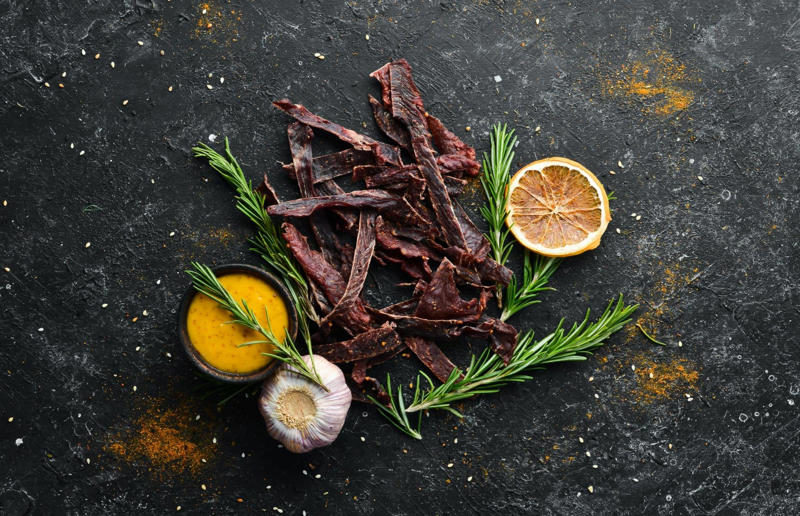 15. Biltong, South Africa 37: Baklava, various locations, 36: Rolex, Uganda, 35: Dadar gulung, Indonesia, 34: Ta'ameya, Egypt, 33: Brownies, USA, 32: Plantain chips, various locations, 31: Koeksister, South Africa, 30: Ma'amoul, Egypt, 29: Takoyaki, Japan, 28: Rice Krispie treats, USA, 27: Poffertjes, Netherlands, 26: Haggis bon bons, Scotland, 25: Pão de queijo, Brazil, 24: Chocolate digestives, UK, 23: Churros, Spain, 22: Kartoffelpuffer, Germany, 21: Stroopwafel, Netherlands, 20: Mooncake, China, 19: Sausage roll, UK, 18: Biltong, South Africa, 17: Aloo tikki, India, 16: Qatayef, Middle East, 15: Lamington, Australia, 14: S'mores, USA, 13: Meat pie, Australia and New Zealand, 12: Lumpia, Indonesia and the Philippines, 11: Nanaimo bar, Canada, 10: Pain au chocolat, France, 9: Mochi, Japan, 8: Pani puri, India, 7: Doughnut, various locations, 6: Poutine, Canada, 5: Currywurst, Germany, 4: Macaron, France, 3: Nachos, Mexico, 2: Samosa, various locations