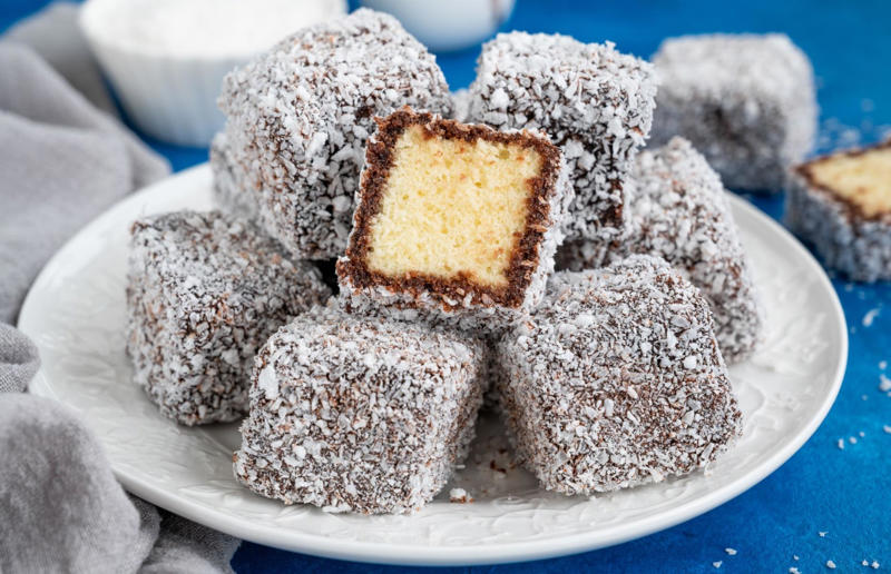 13. Lamington, Australia 37: Baklava, various locations, 36: Rolex, Uganda, 35: Dadar gulung, Indonesia, 34: Ta'ameya, Egypt, 33: Brownies, USA, 32: Plantain chips, various locations, 31: Koeksister, South Africa, 30: Ma'amoul, Egypt, 29: Takoyaki, Japan, 28: Rice Krispie treats, USA, 27: Poffertjes, Netherlands, 26: Haggis bon bons, Scotland, 25: Pão de queijo, Brazil, 24: Chocolate digestives, UK, 23: Churros, Spain, 22: Kartoffelpuffer, Germany, 21: Stroopwafel, Netherlands, 20: Mooncake, China, 19: Sausage roll, UK, 18: Biltong, South Africa, 17: Aloo tikki, India, 16: Qatayef, Middle East, 15: Lamington, Australia, 14: S'mores, USA, 13: Meat pie, Australia and New Zealand, 12: Lumpia, Indonesia and the Philippines, 11: Nanaimo bar, Canada, 10: Pain au chocolat, France, 9: Mochi, Japan, 8: Pani puri, India, 7: Doughnut, various locations, 6: Poutine, Canada, 5: Currywurst, Germany, 4: Macaron, France, 3: Nachos, Mexico, 2: Samosa, various locations