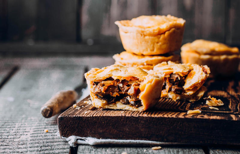 11. Meat pie, Australia and New Zealand 37: Baklava, various locations, 36: Rolex, Uganda, 35: Dadar gulung, Indonesia, 34: Ta'ameya, Egypt, 33: Brownies, USA, 32: Plantain chips, various locations, 31: Koeksister, South Africa, 30: Ma'amoul, Egypt, 29: Takoyaki, Japan, 28: Rice Krispie treats, USA, 27: Poffertjes, Netherlands, 26: Haggis bon bons, Scotland, 25: Pão de queijo, Brazil, 24: Chocolate digestives, UK, 23: Churros, Spain, 22: Kartoffelpuffer, Germany, 21: Stroopwafel, Netherlands, 20: Mooncake, China, 19: Sausage roll, UK, 18: Biltong, South Africa, 17: Aloo tikki, India, 16: Qatayef, Middle East, 15: Lamington, Australia, 14: S'mores, USA, 13: Meat pie, Australia and New Zealand, 12: Lumpia, Indonesia and the Philippines, 11: Nanaimo bar, Canada, 10: Pain au chocolat, France, 9: Mochi, Japan, 8: Pani puri, India, 7: Doughnut, various locations, 6: Poutine, Canada, 5: Currywurst, Germany, 4: Macaron, France, 3: Nachos, Mexico, 2: Samosa, various locations